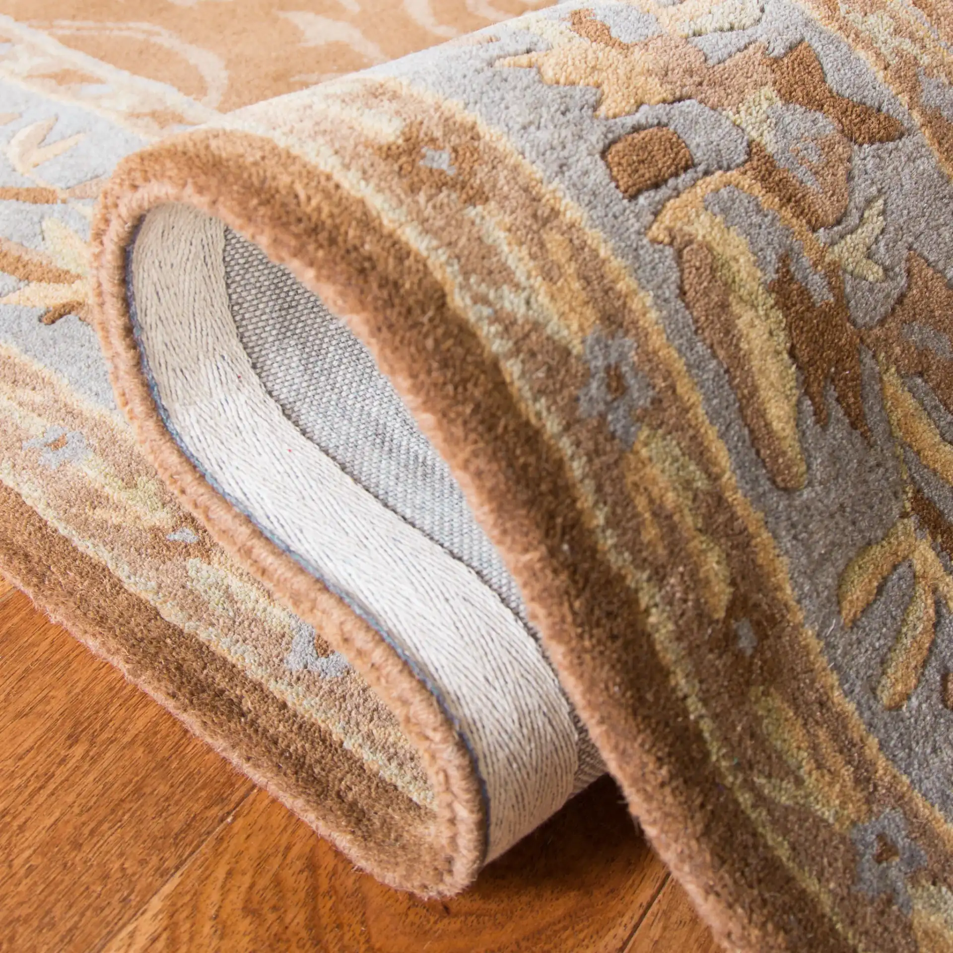 Empire Floral Medallion Hand-Tufted Wool Rug in Blue / Brown in a styled room