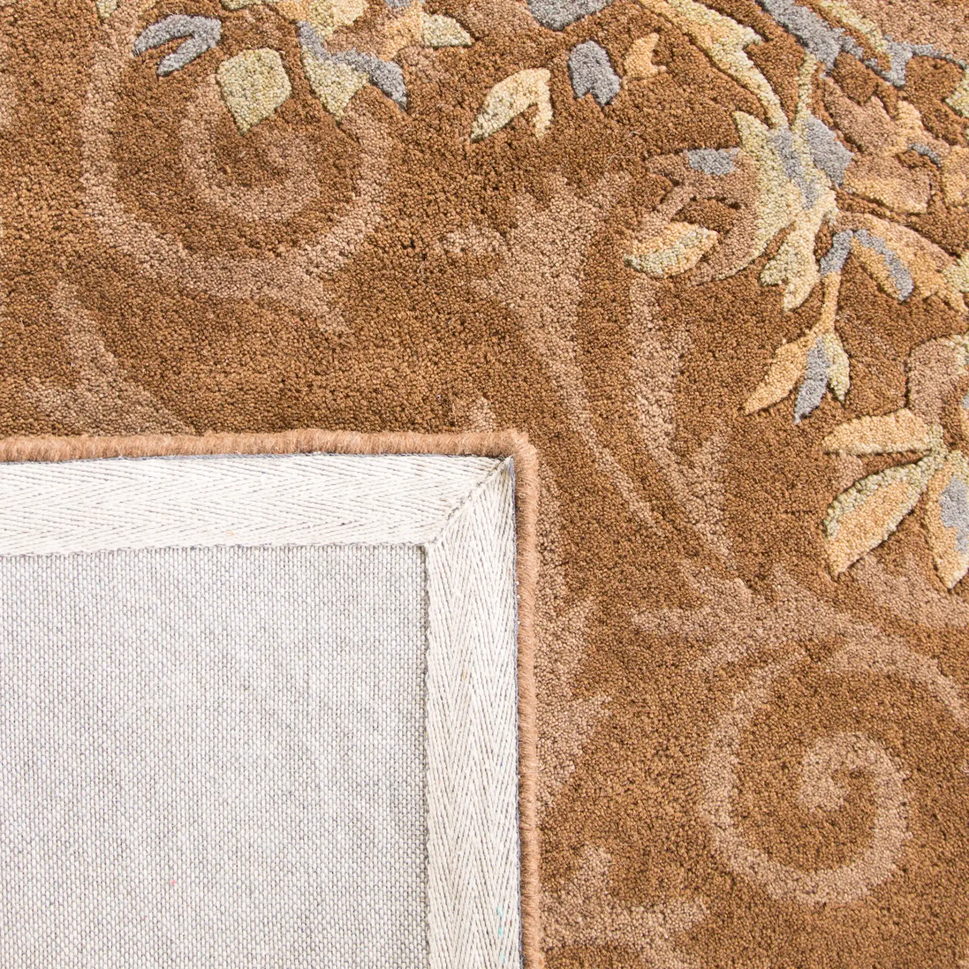 Empire Floral Medallion Hand-Tufted Wool Rug in Blue / Brown in a styled room