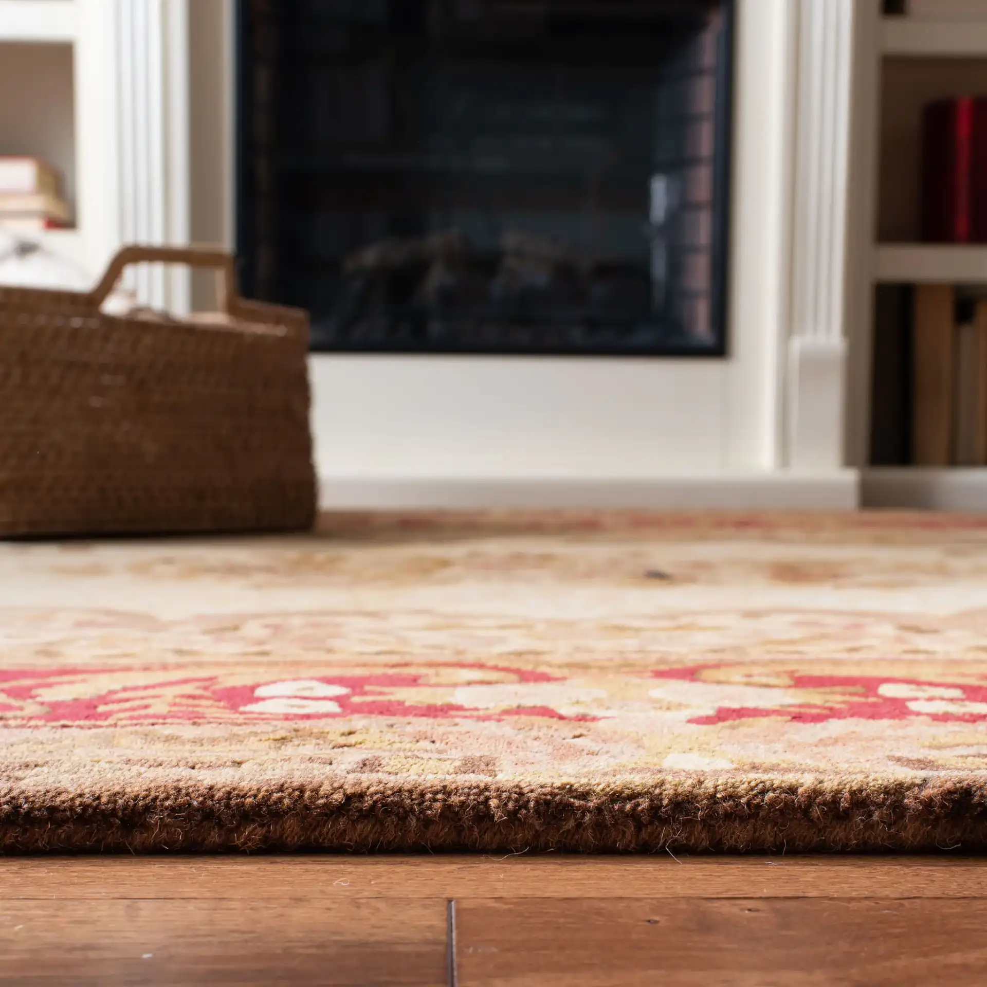 Empire Oval Medallion Bordered Hand-Tufted Wool Rug in Light Gold / Red in a styled room
