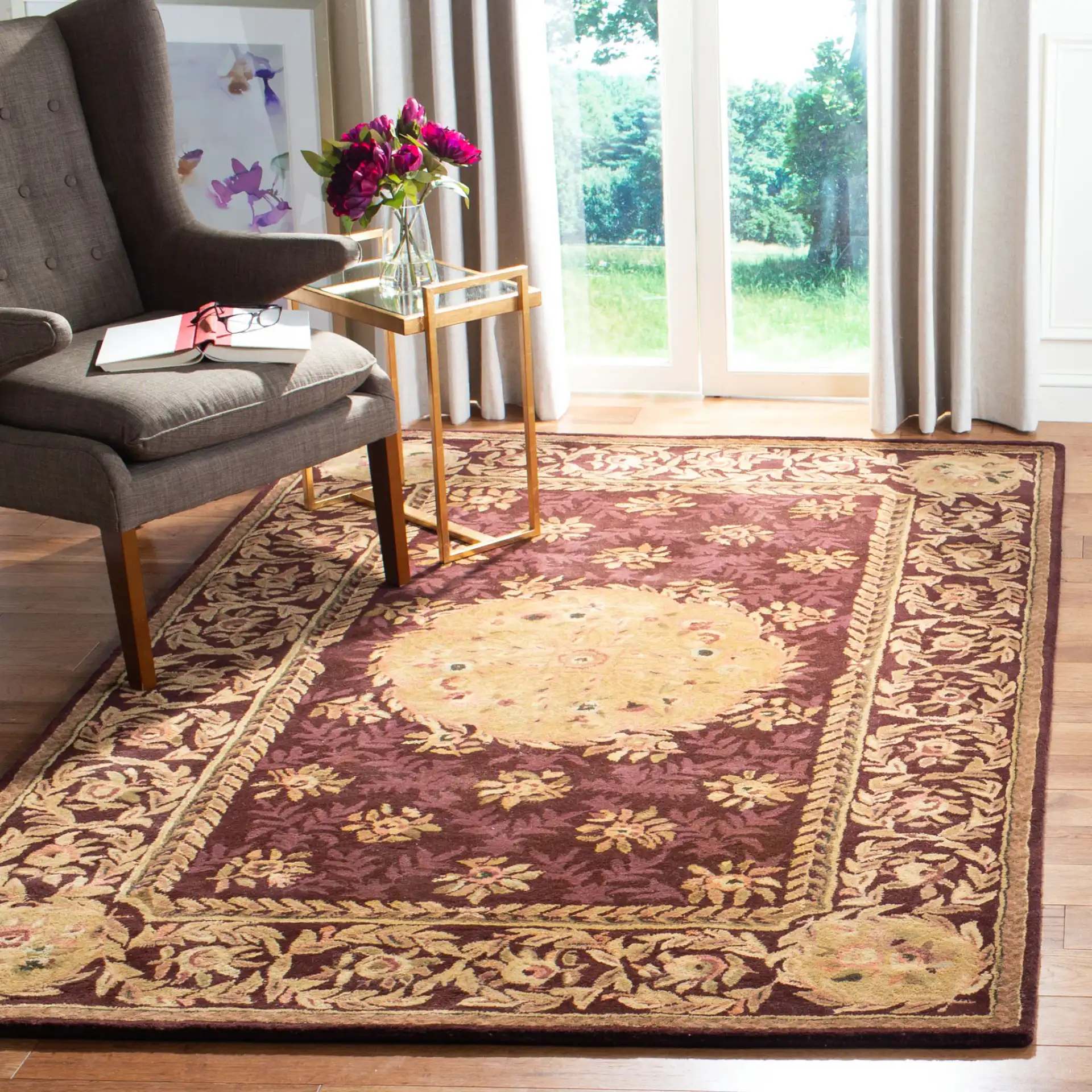 Empire Floral Rosette Bordered Hand-Tufted Wool Rug in Burgundy in a styled room