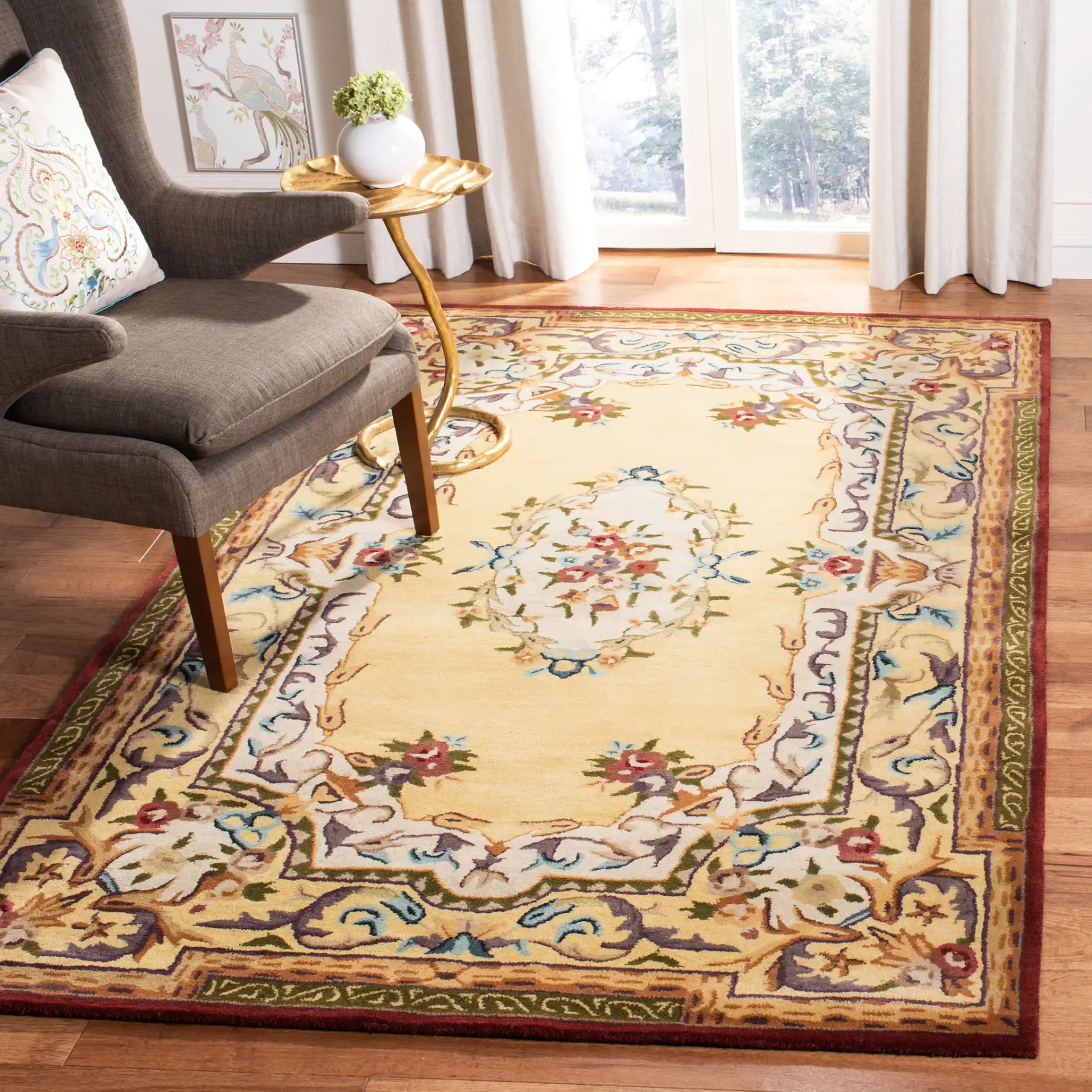 Empire Floral Bouquet Bordered Hand-Tufted Wool Rug in Gold in a styled room