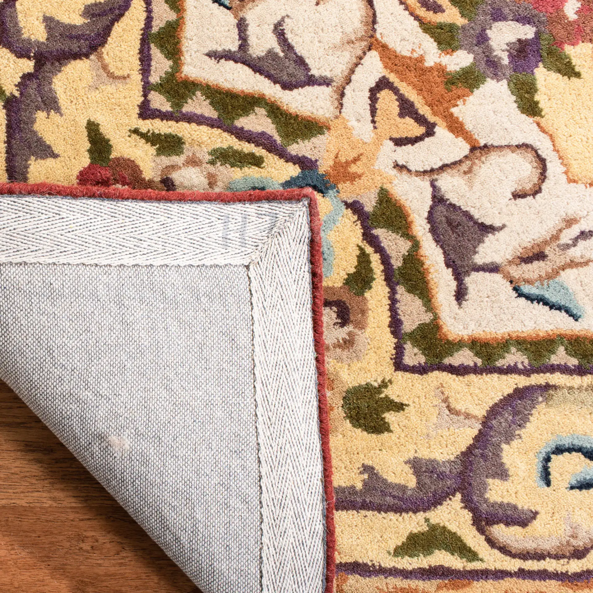 Empire Floral Bouquet Bordered Hand-Tufted Wool Rug in Gold in a styled room