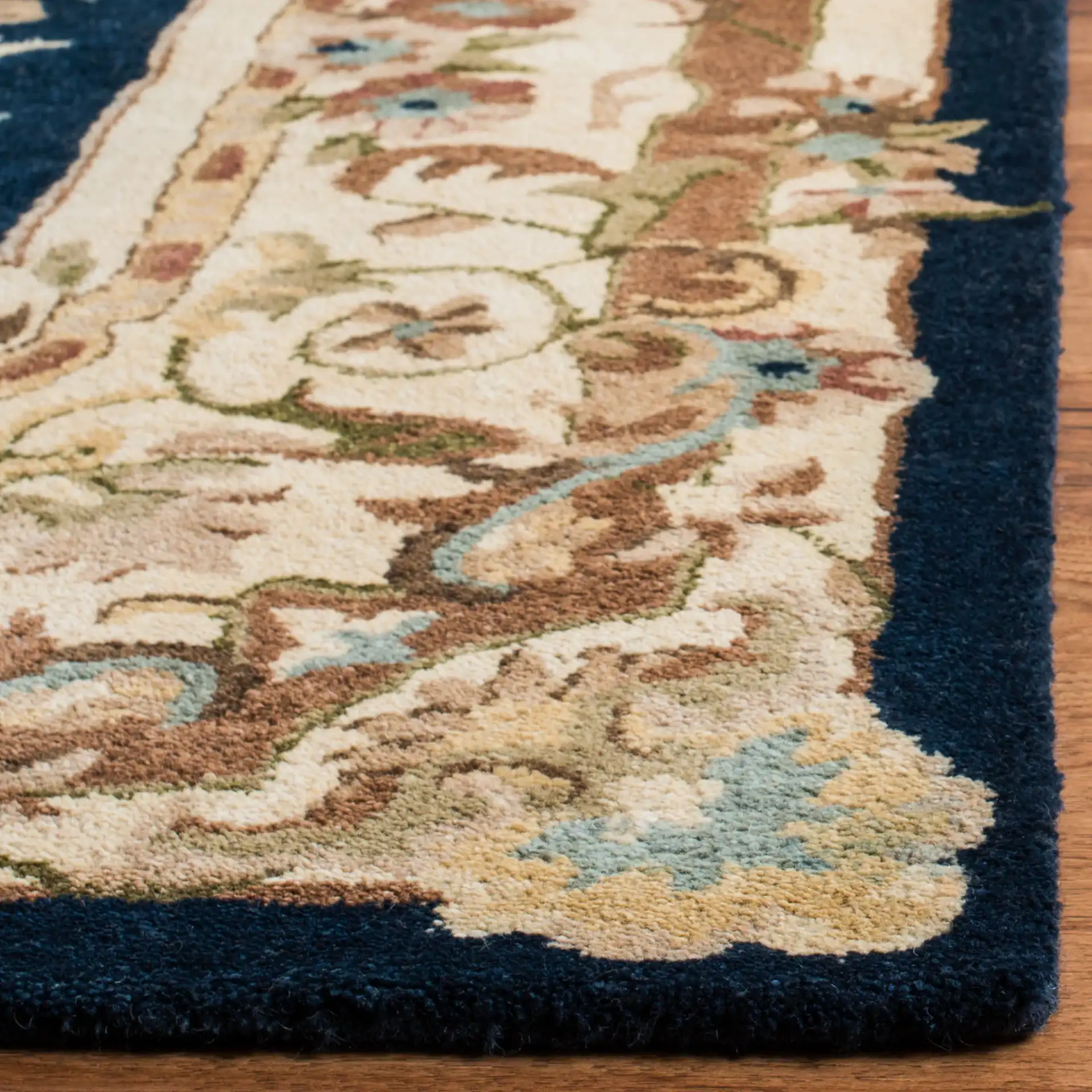 Empire Medallion Floral Hand-Tufted Wool Rug in Navy / Beige in a styled room