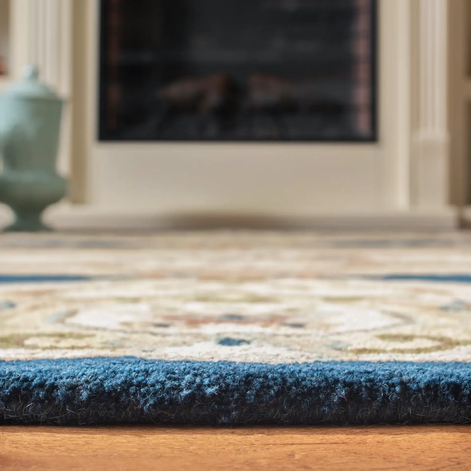 Empire Medallion Floral Hand-Tufted Wool Rug in Navy / Beige in a styled room