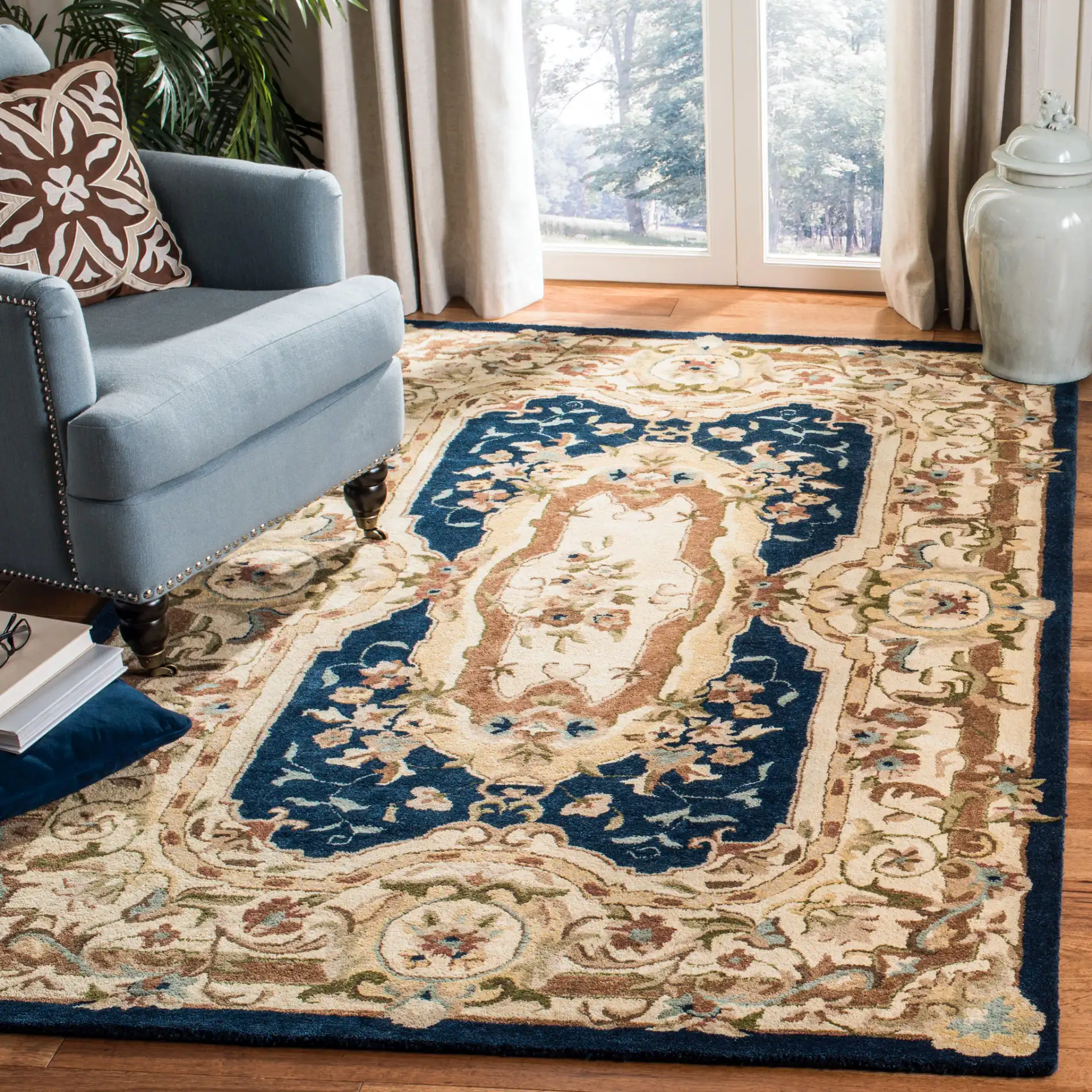 Empire Medallion Floral Hand-Tufted Wool Rug in Navy / Beige in a styled room