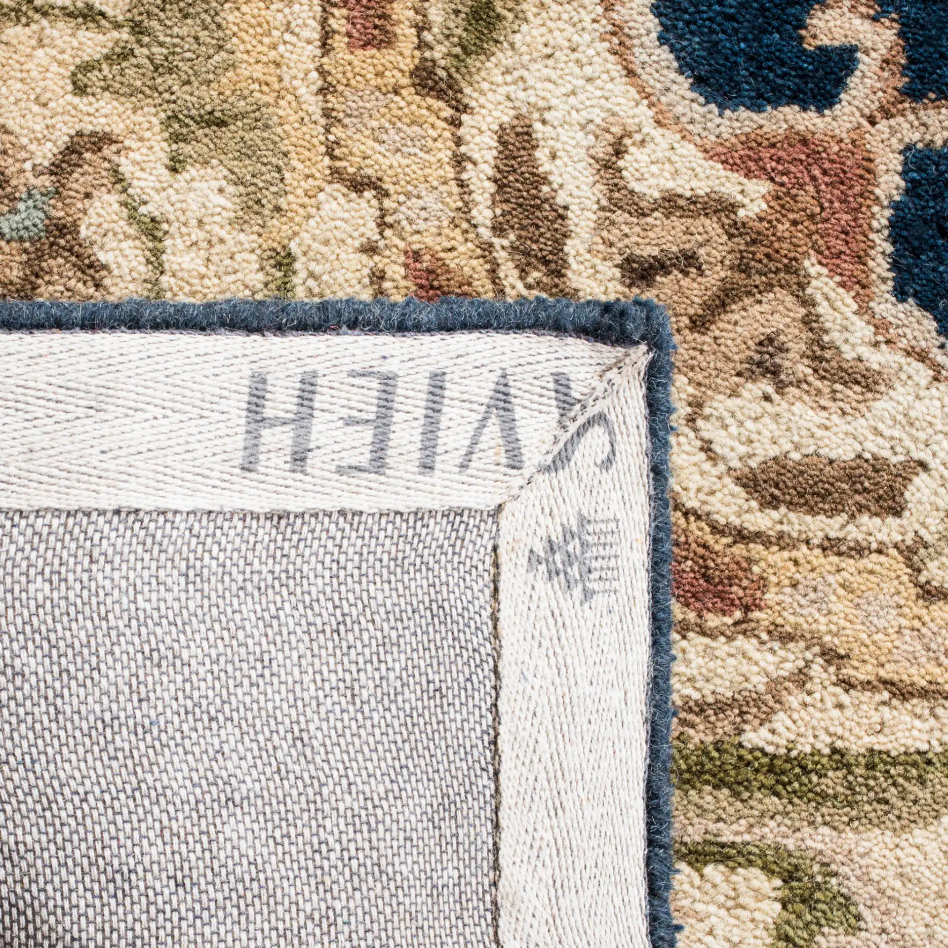 Empire Medallion Floral Hand-Tufted Wool Rug in Navy / Beige in a styled room