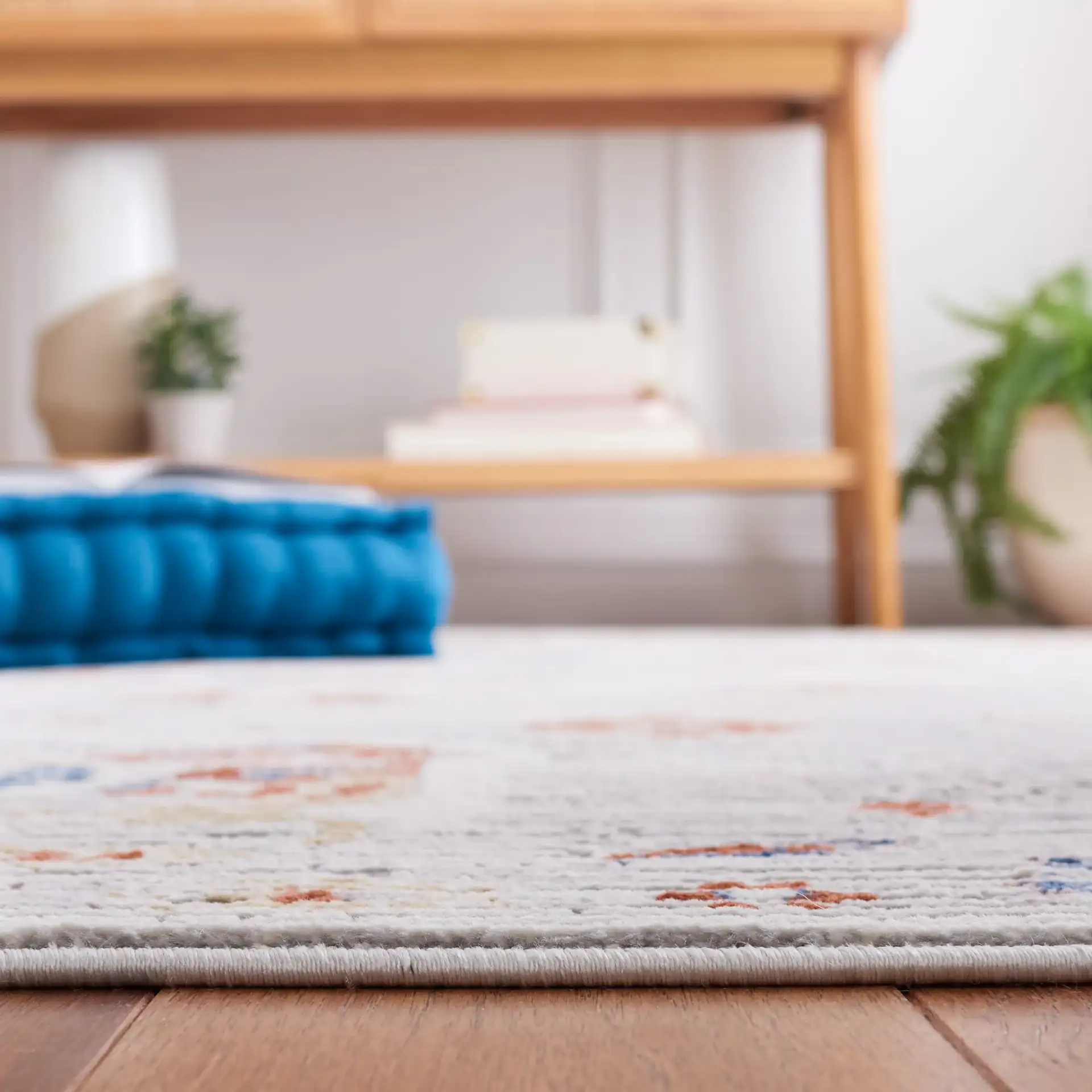 Eternal Distressed Floral Rug in Gray / Blue Rust in a styled room