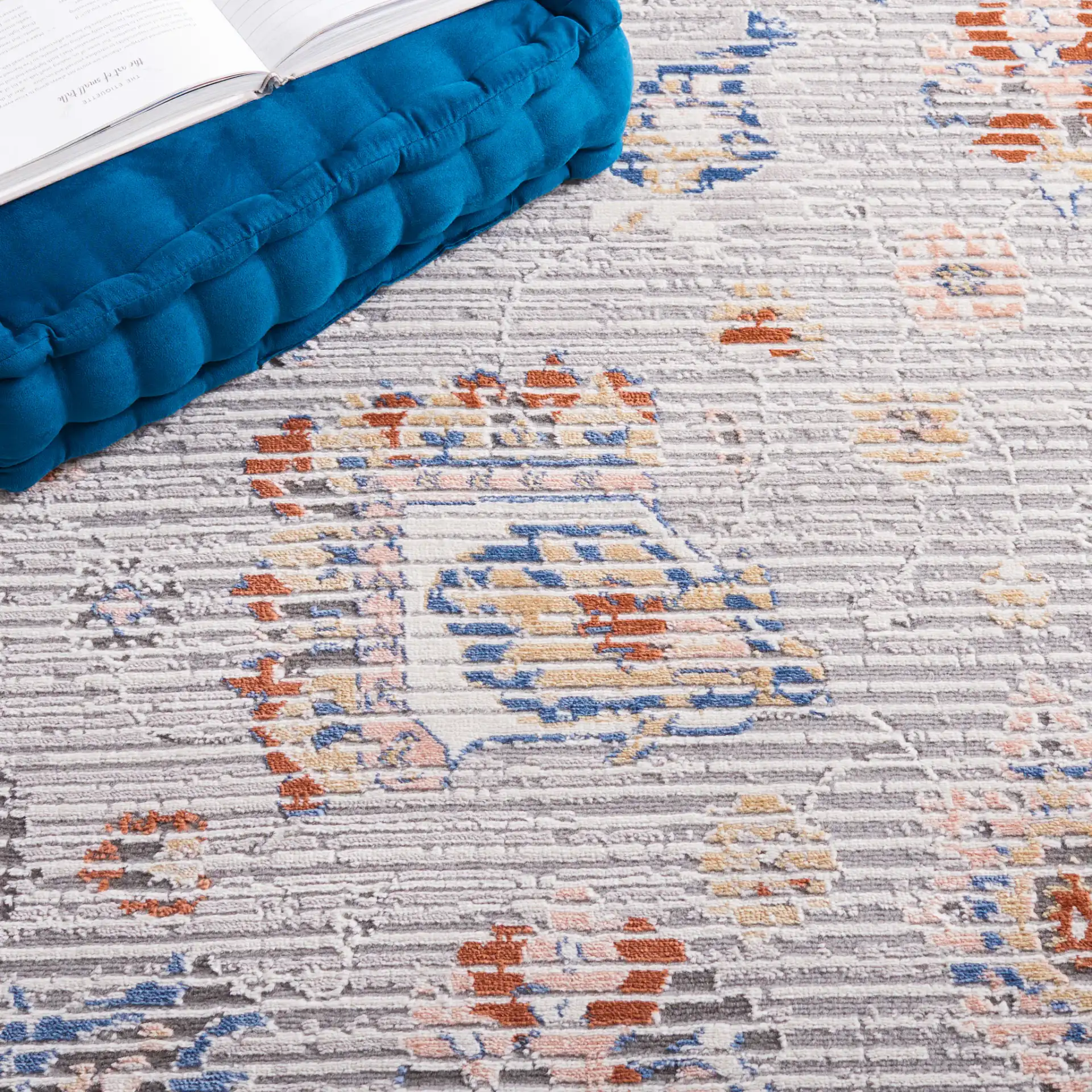 Eternal Distressed Floral Rug in Gray / Blue Rust in a styled room
