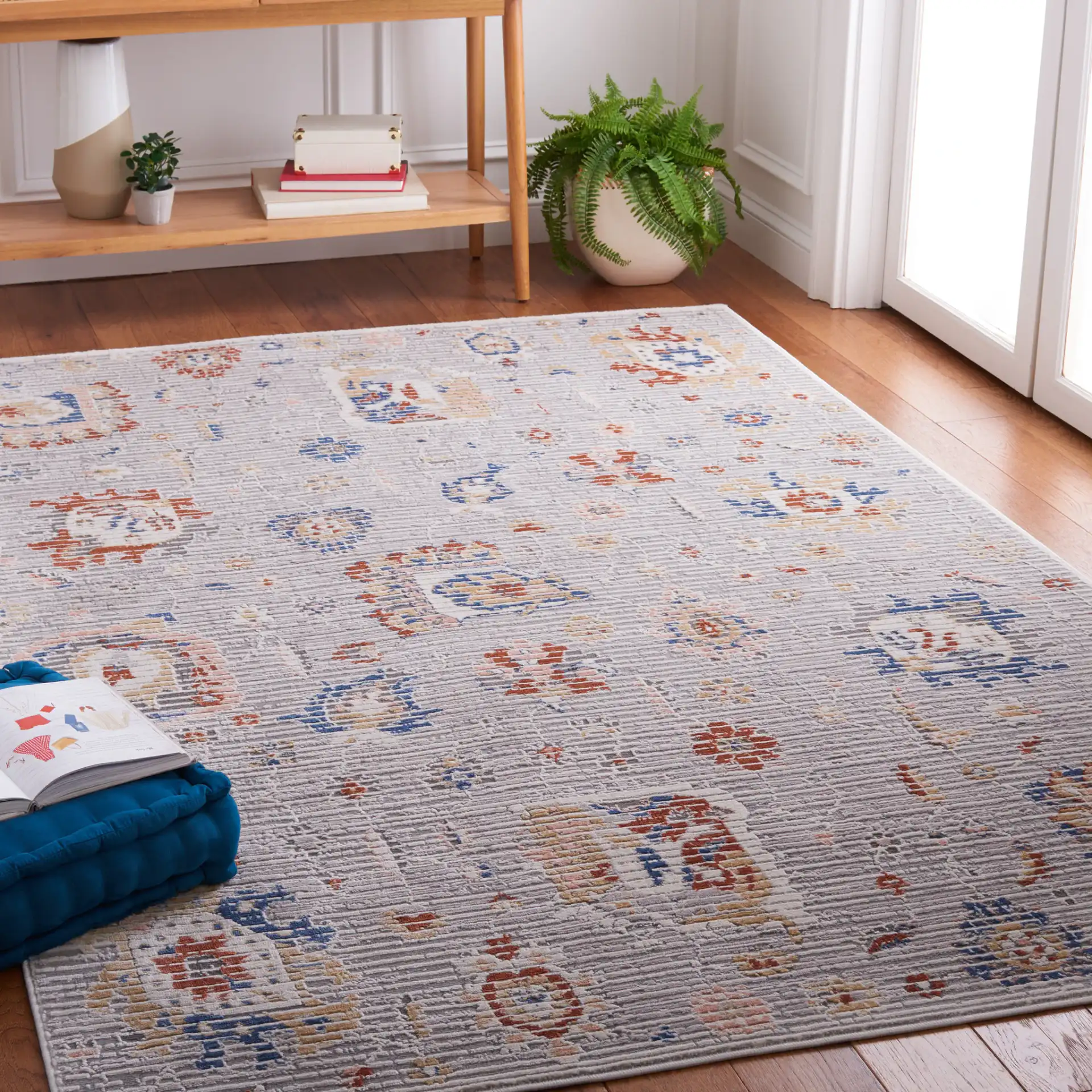 Eternal Distressed Floral Rug in Gray / Blue Rust in a styled room