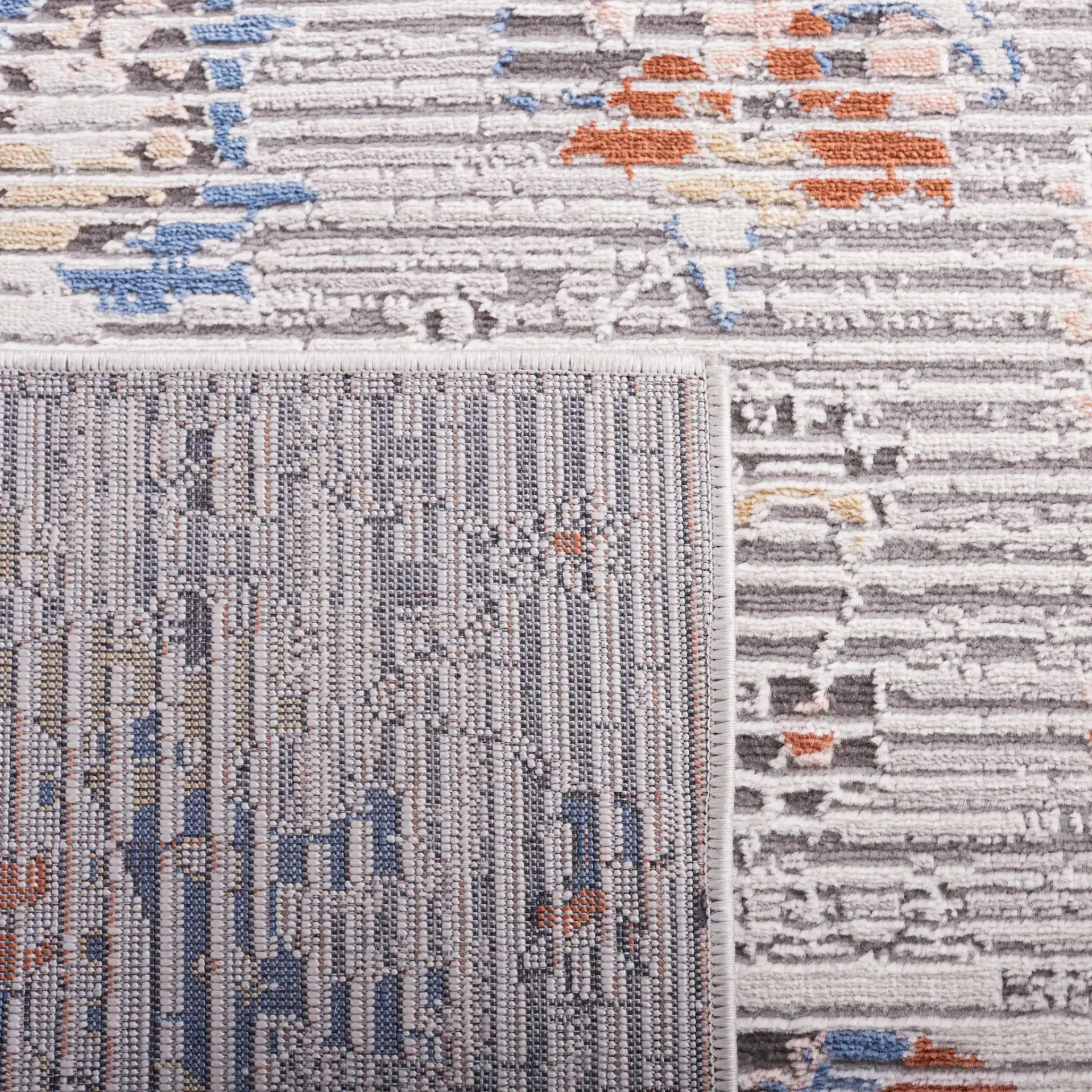 Eternal Distressed Floral Rug in Gray / Blue Rust in a styled room