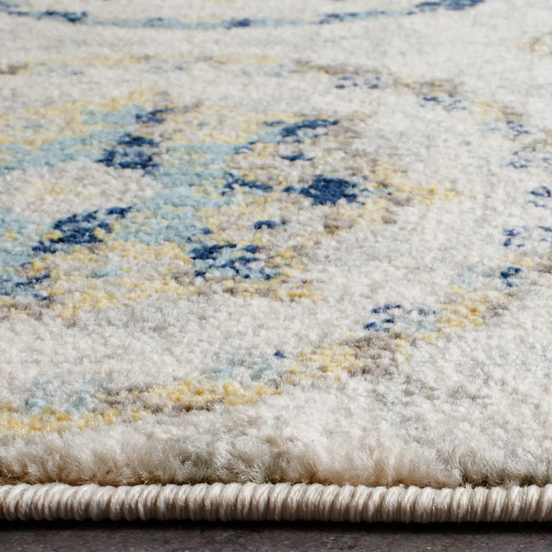 Evoke Circular Medallion Rug in Ivory / Blue in a styled room