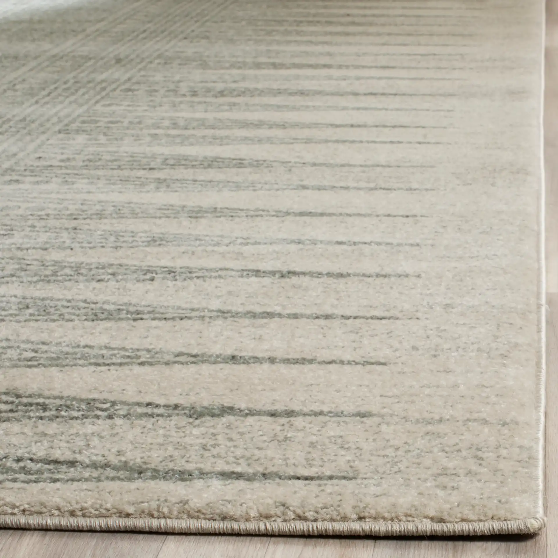 Evoke Spiked Band Rug in Ivory / Silver in a styled room