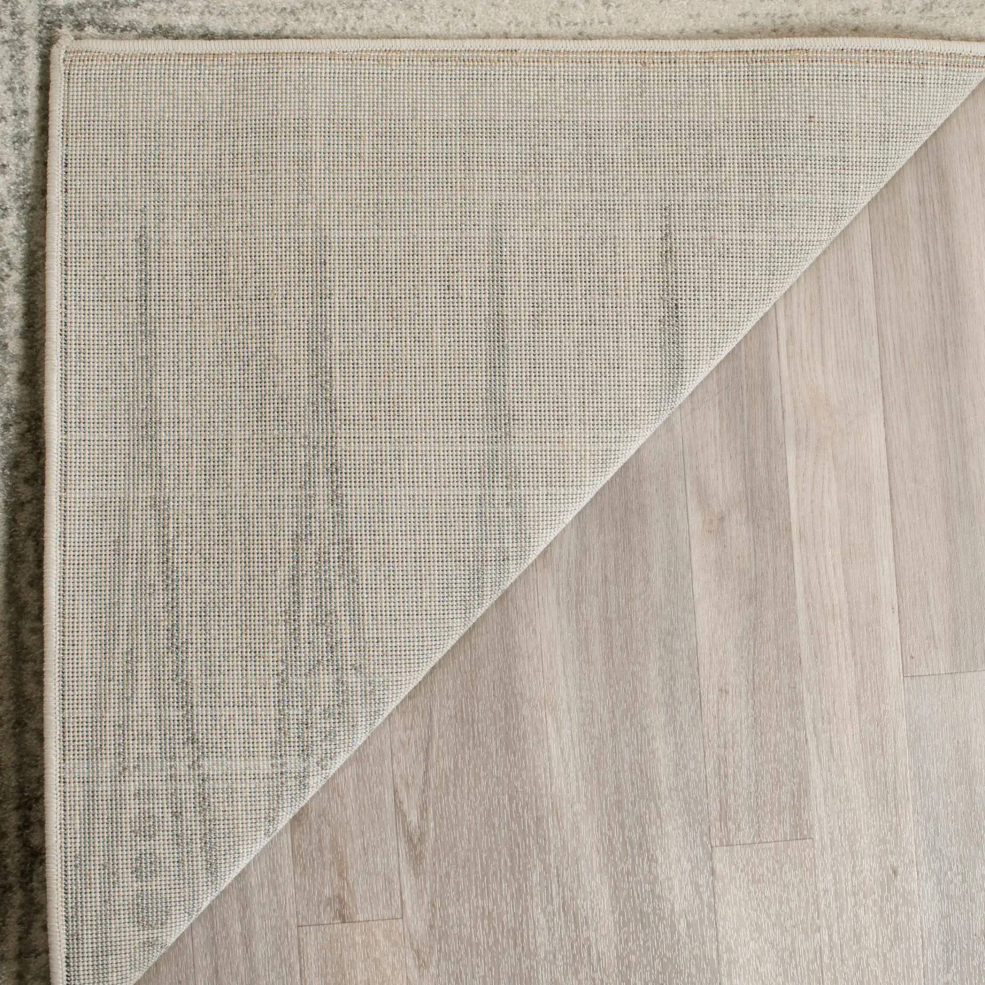 Evoke Spiked Band Rug in Ivory / Silver in a styled room
