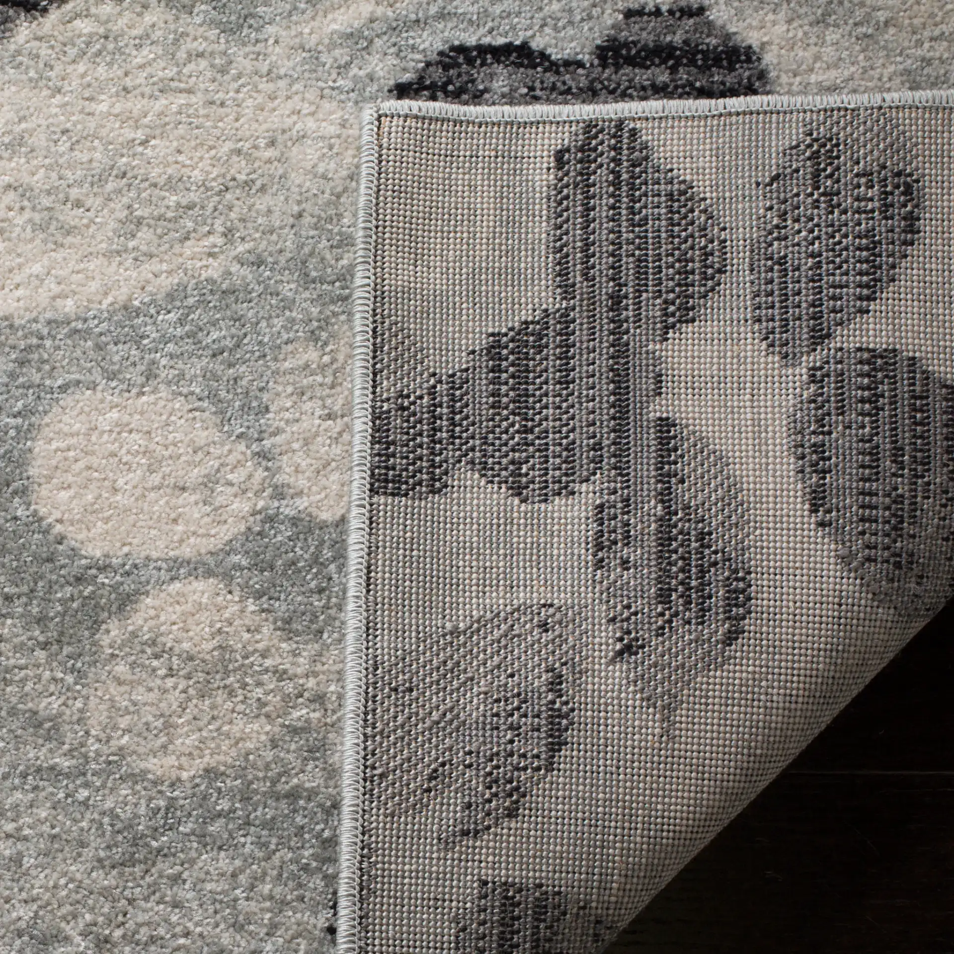Evoke Allover Floral Rug in Gray / Black in a styled room