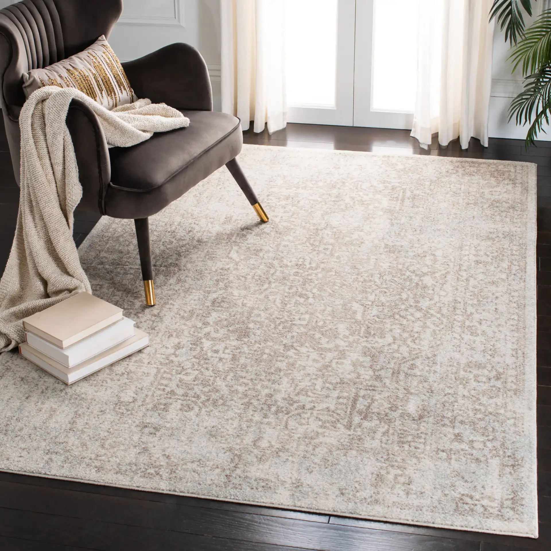 Evoke Distressed Medallion Rug in Ivory / Taupe in a styled room