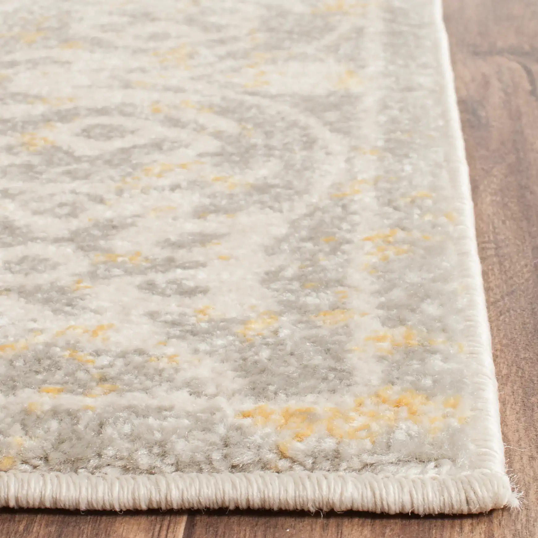 Evoke Distressed Damask Border Rug in Ivory / Gray in a styled room