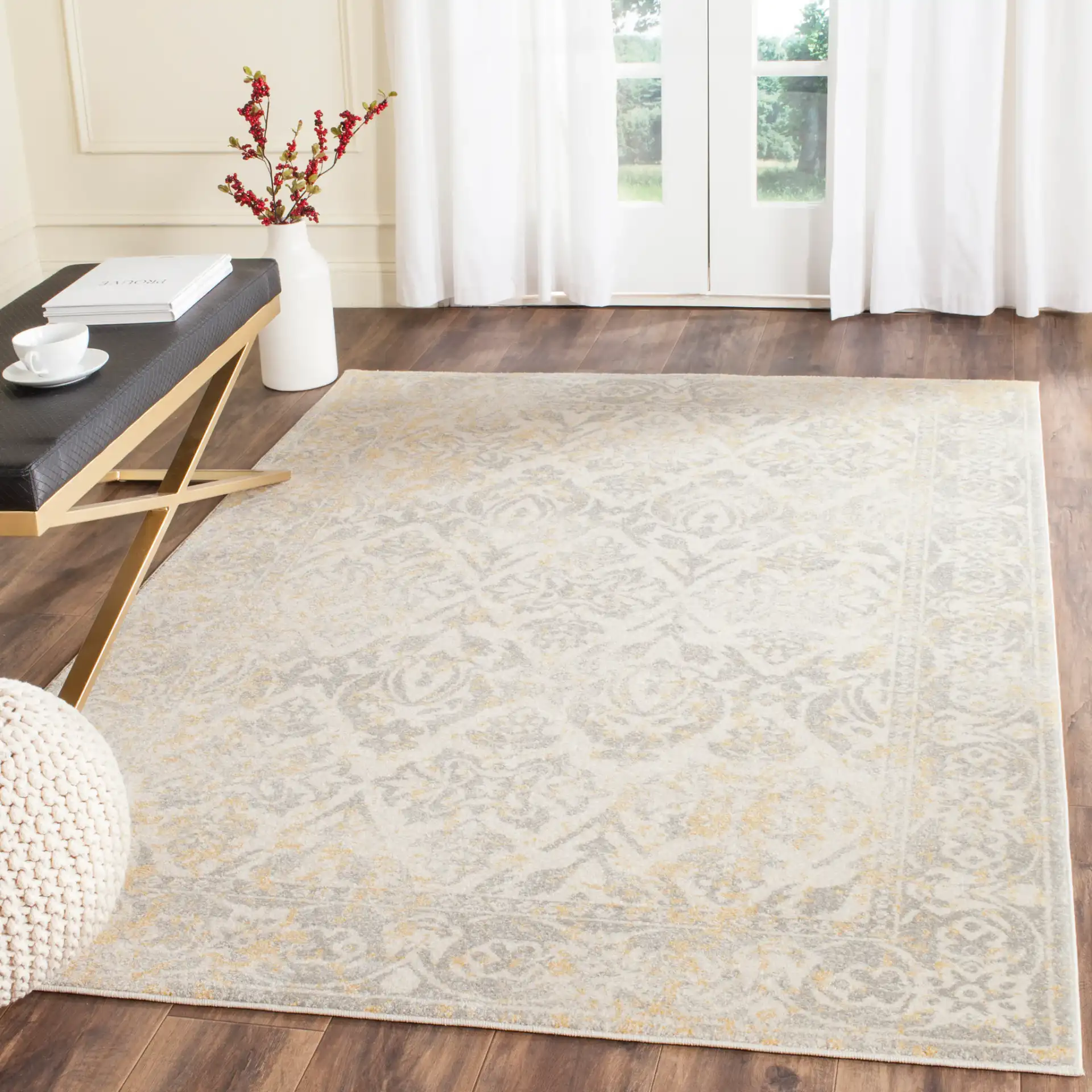 Evoke Distressed Damask Border Rug in Ivory / Gray in a styled room