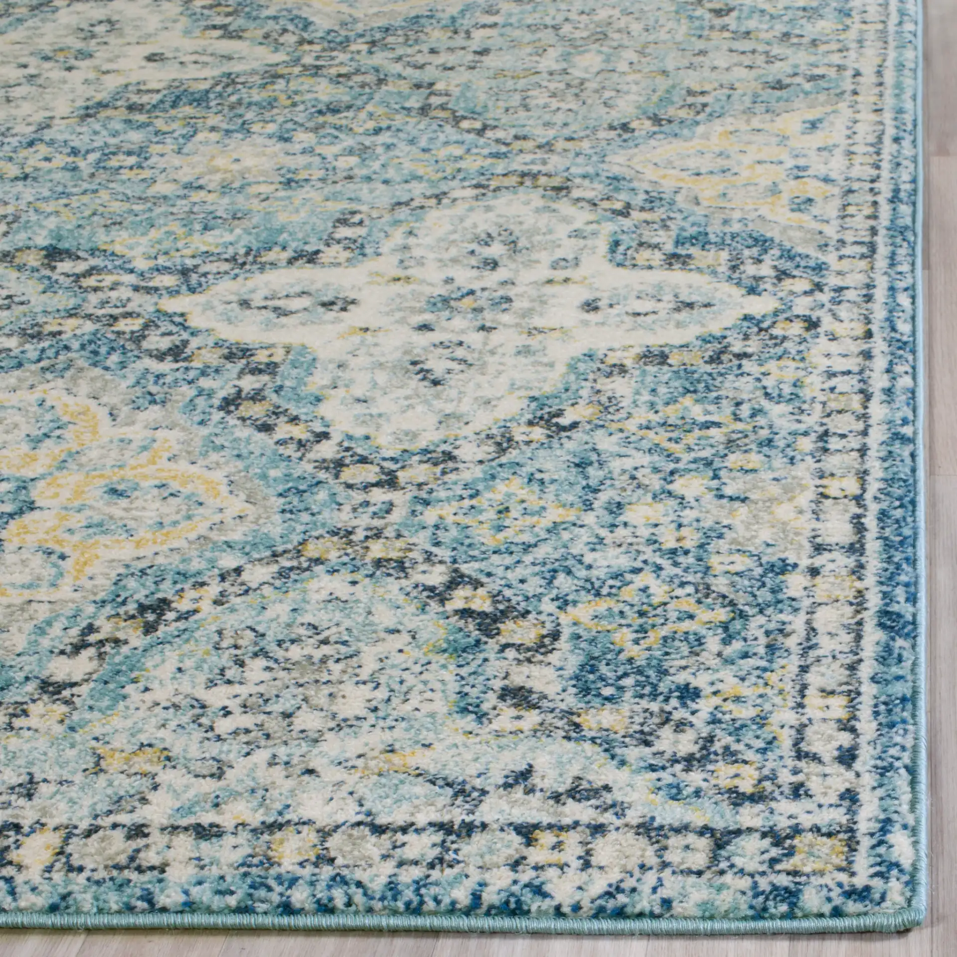 Evoke Medallion Tile Rug in Light Blue / Ivory in a styled room