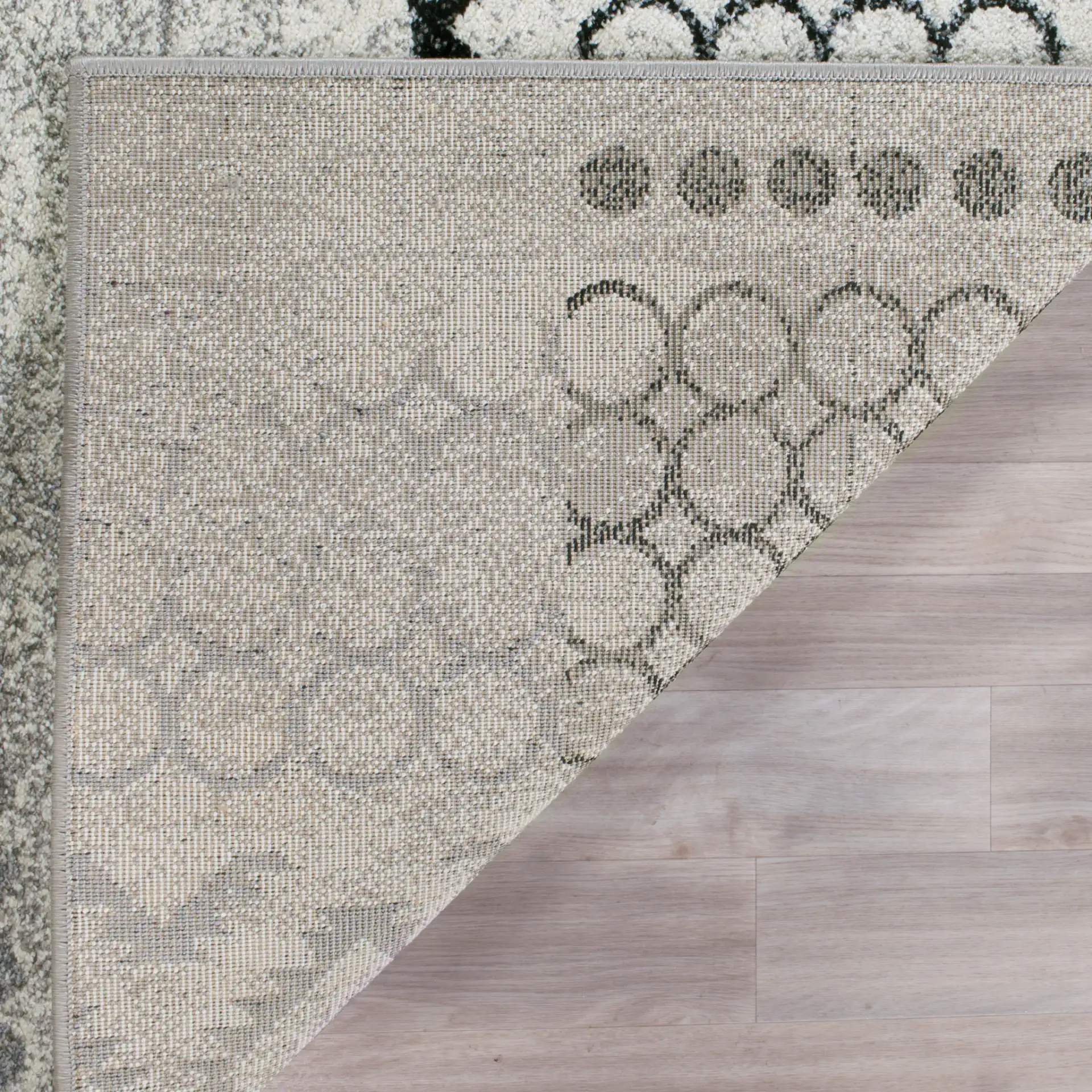Evoke Distressed Patchwork Rug in Cream / Dark Gray in a styled room