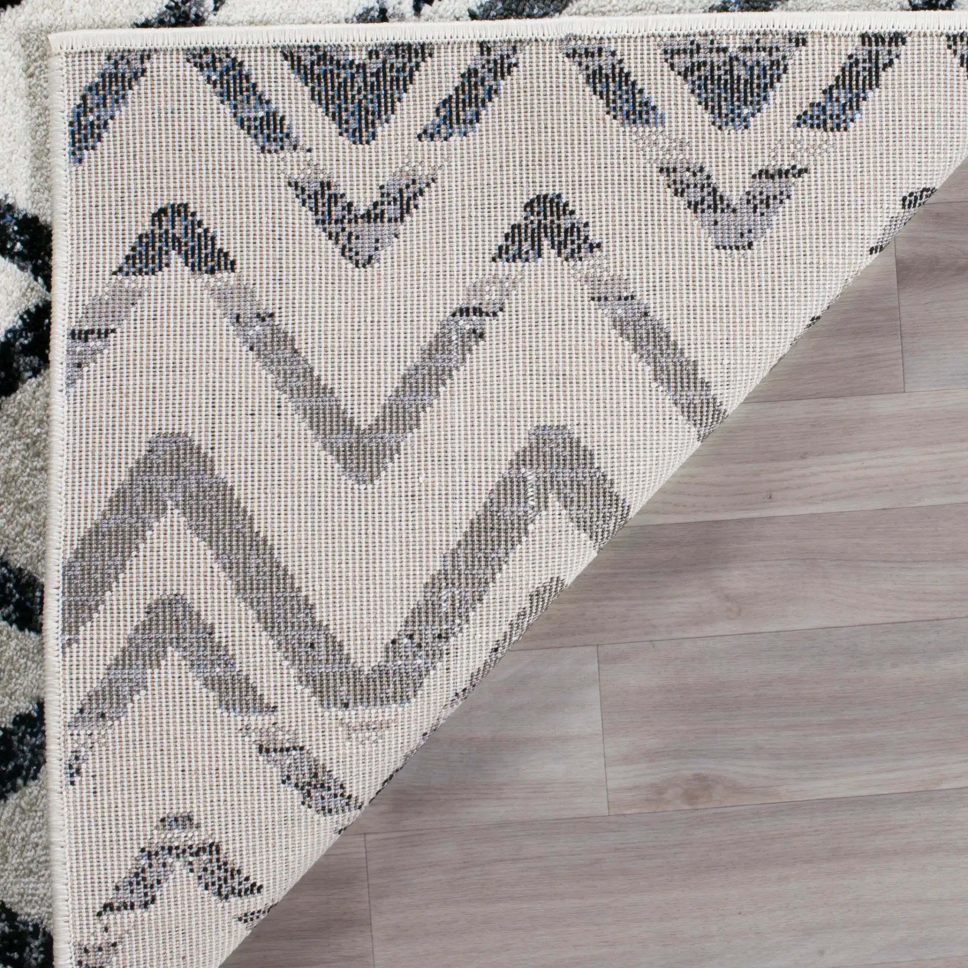 Evoke Chevron Rug in Cream / Blue in a styled room