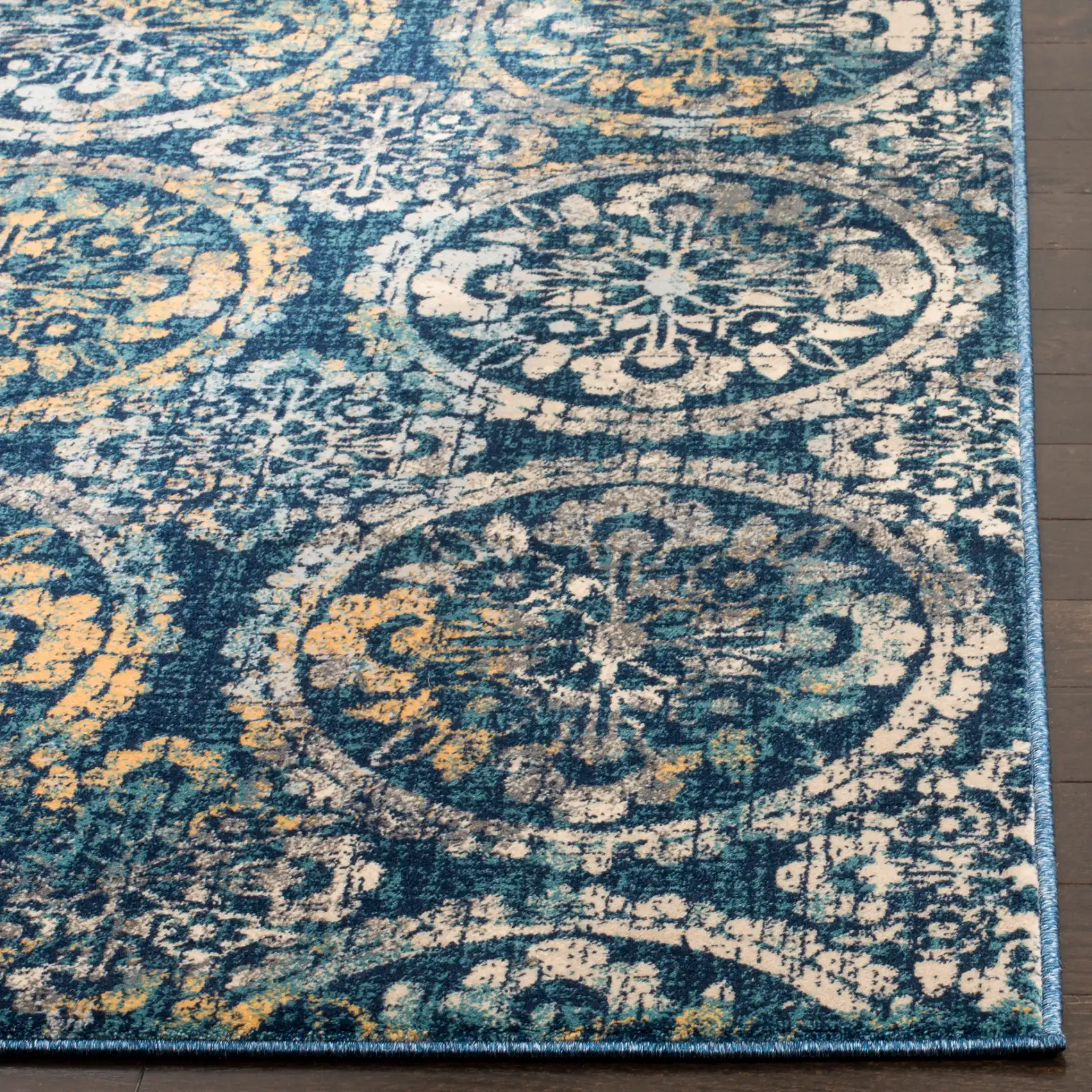 Evoke Repeating Rosette Rug in Navy / Cream in a styled room