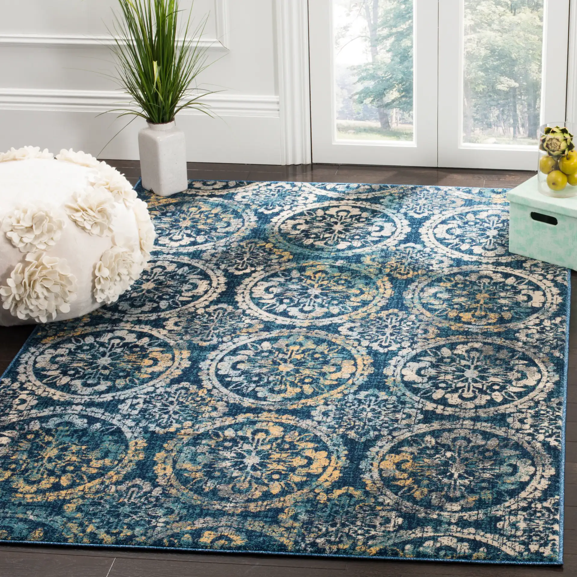 Evoke Repeating Rosette Rug in Navy / Cream in a styled room