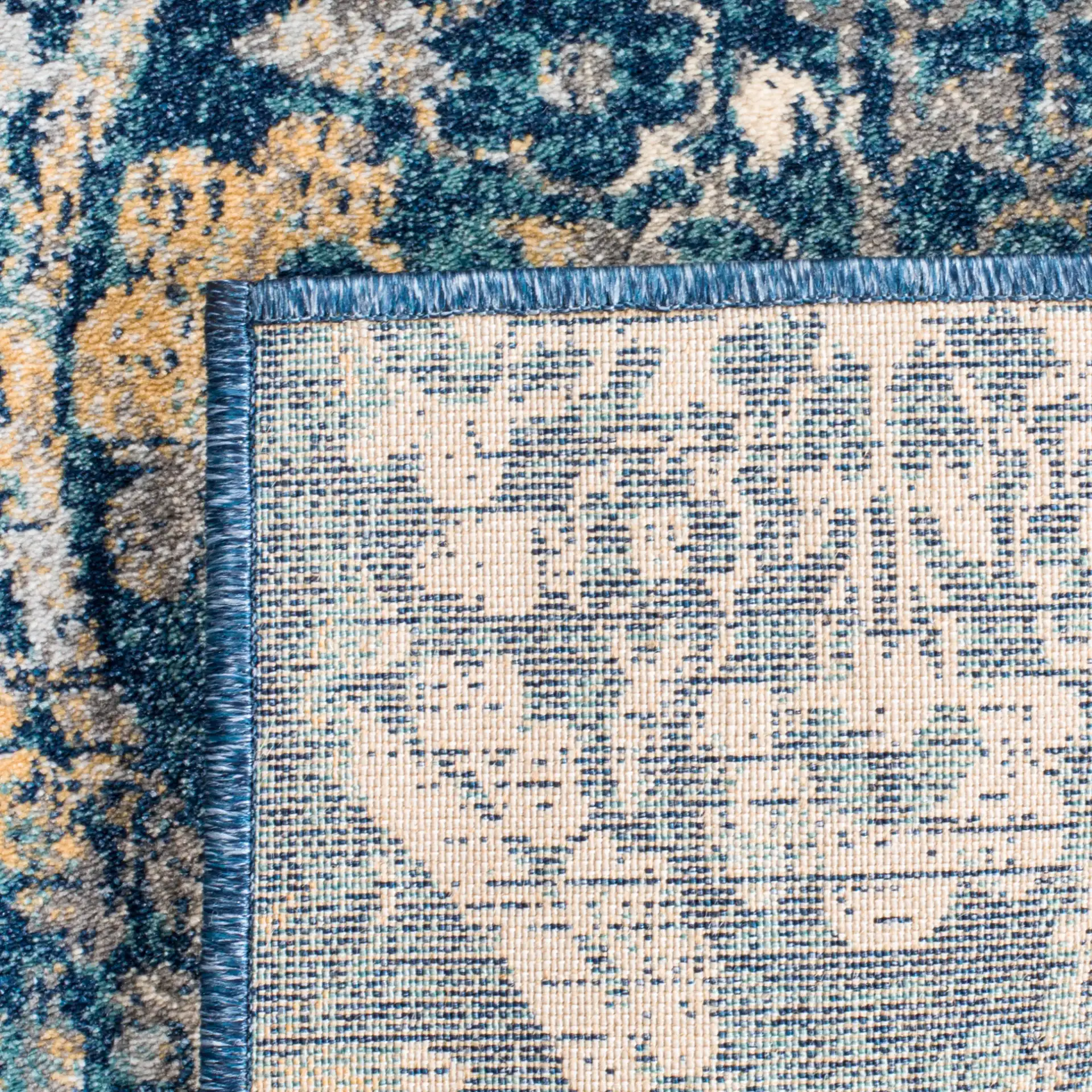 Evoke Repeating Rosette Rug in Navy / Cream in a styled room