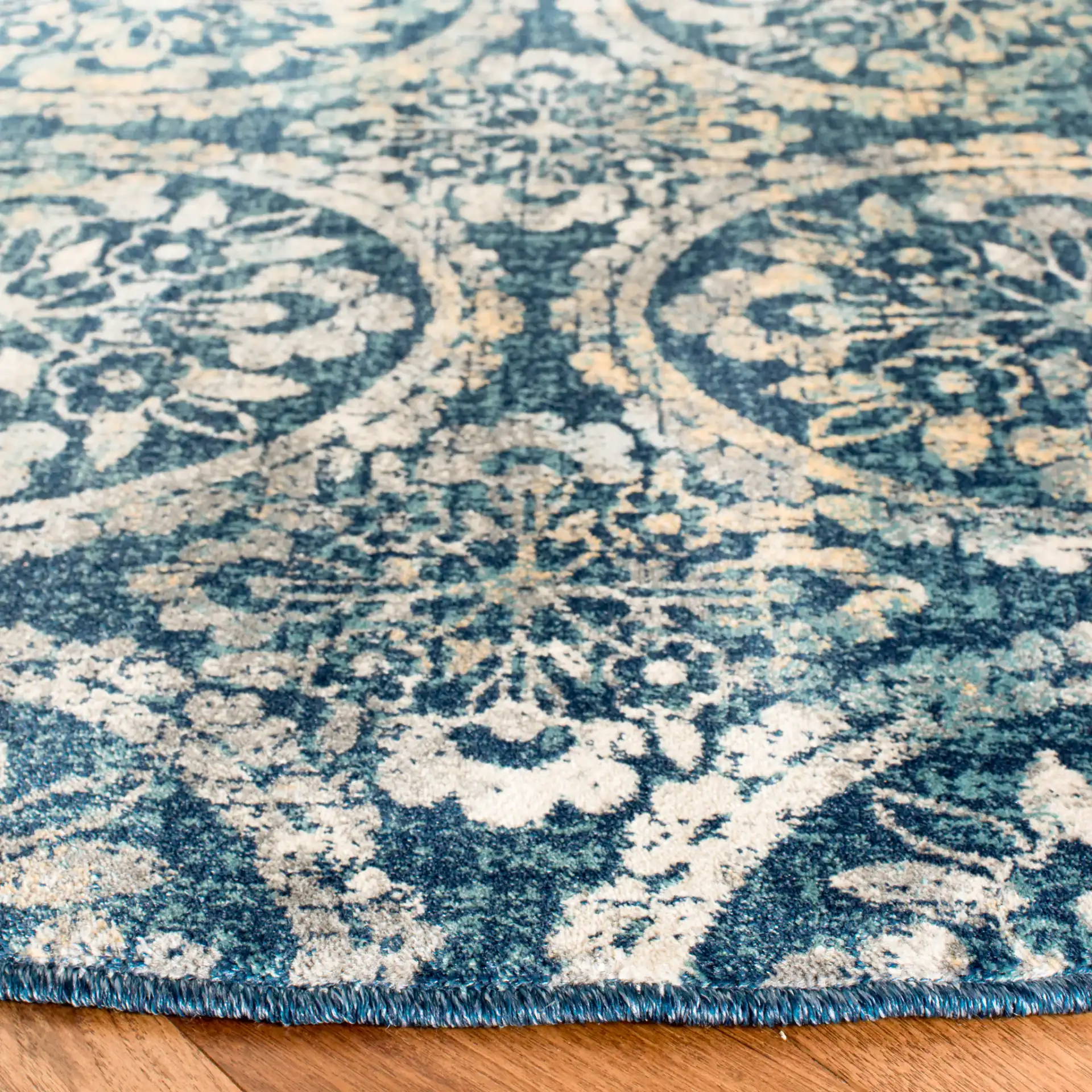 Evoke Repeating Rosette Rug in Navy / Cream in a styled room