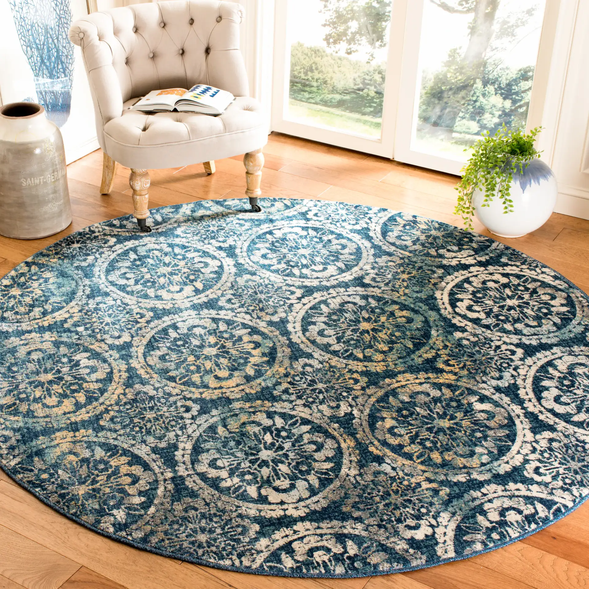 Evoke Repeating Rosette Rug in Navy / Cream in a styled room