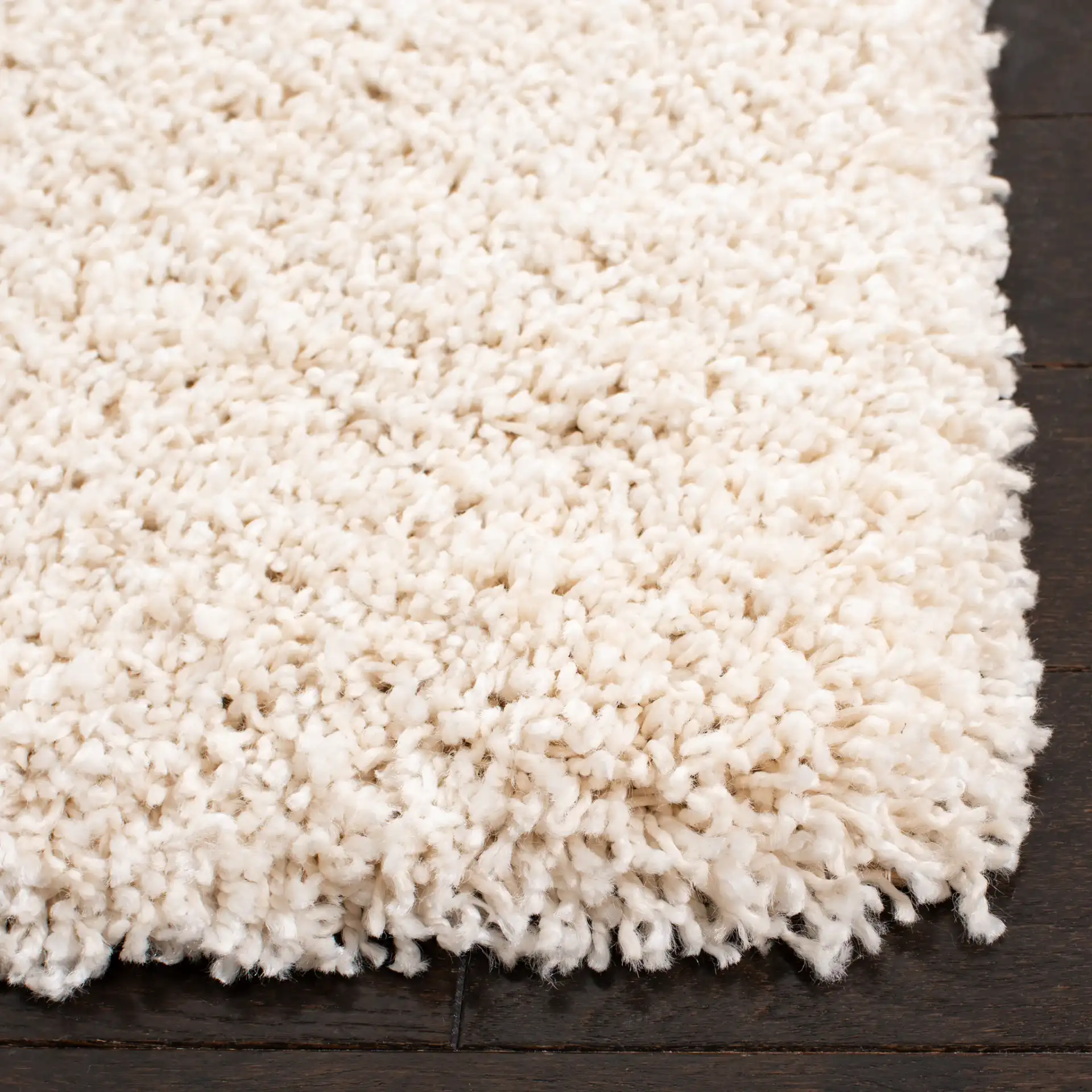 Evolution Solid Shag Rug in Ivory in a styled room