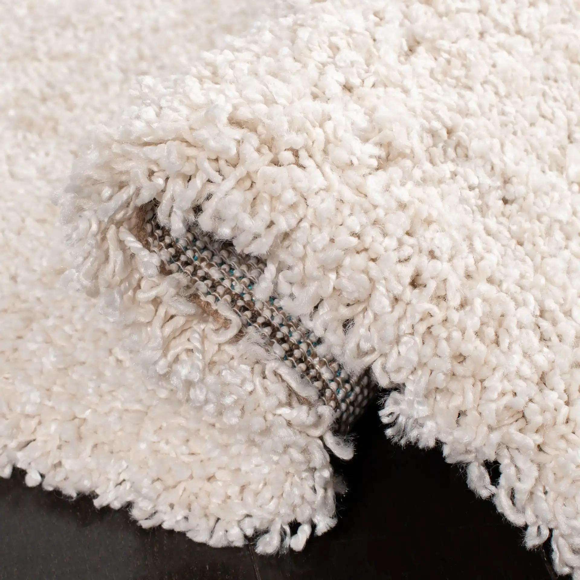 Evolution Solid Shag Rug in Ivory in a styled room