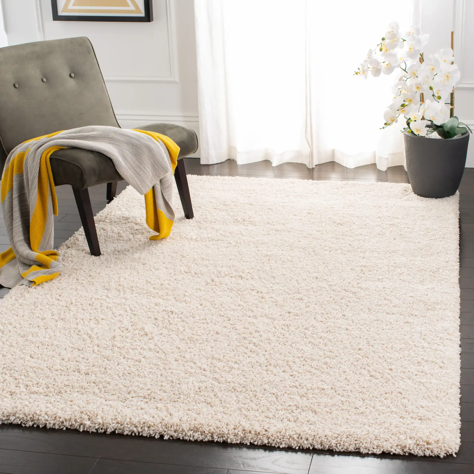 Evolution Solid Shag Rug in Ivory in a styled room