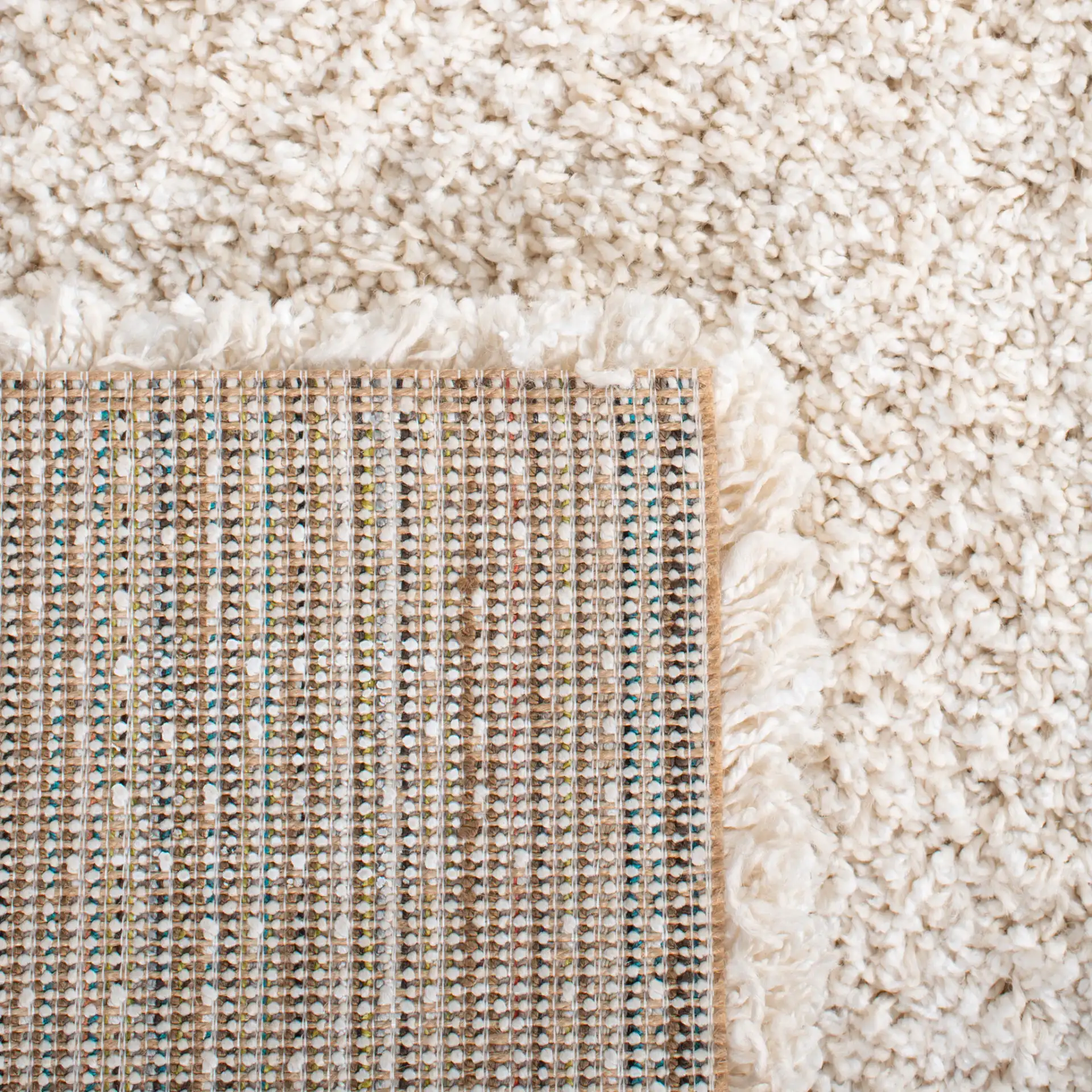 Evolution Solid Shag Rug in Ivory in a styled room