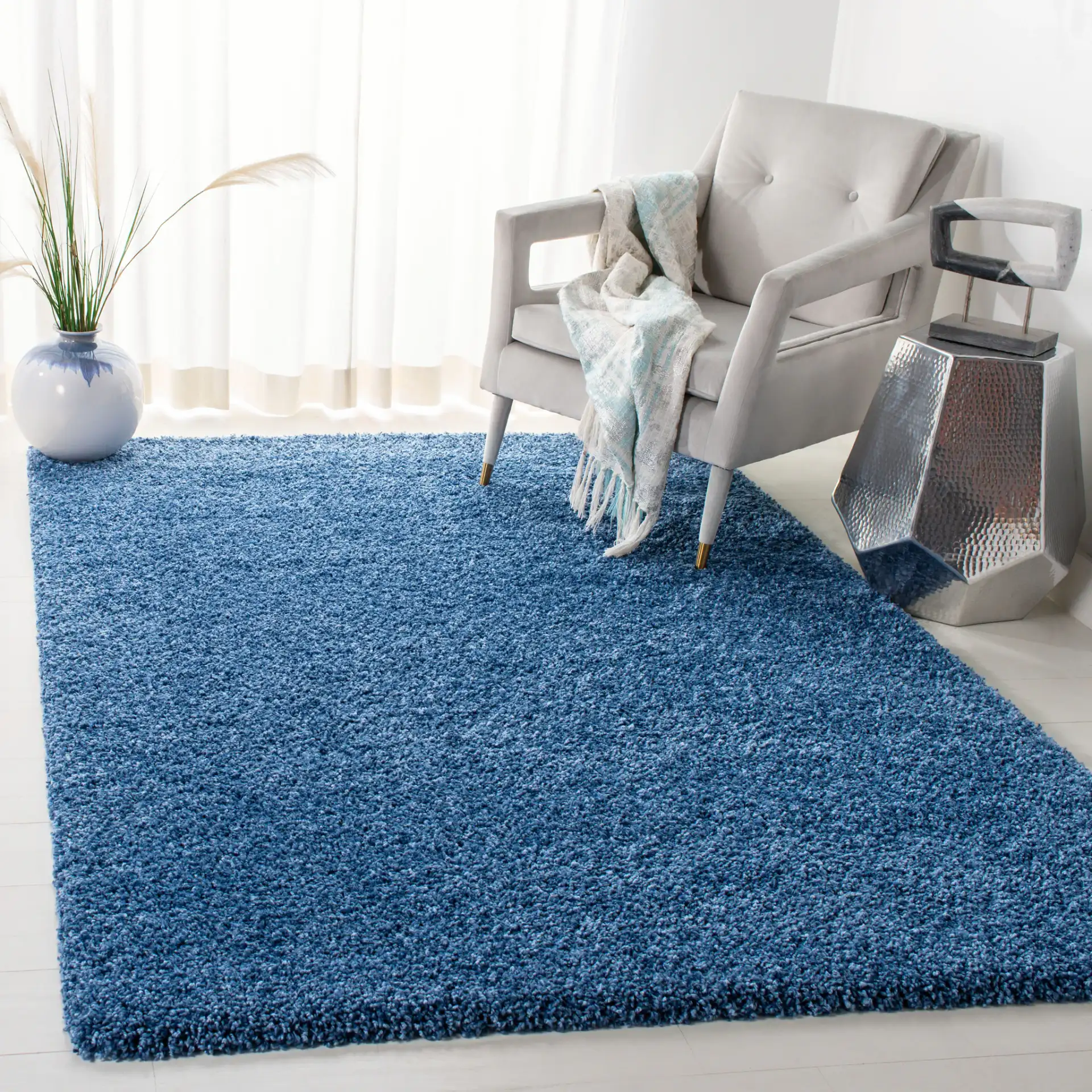Evolution Solid Shag Rug in Blue in a styled room