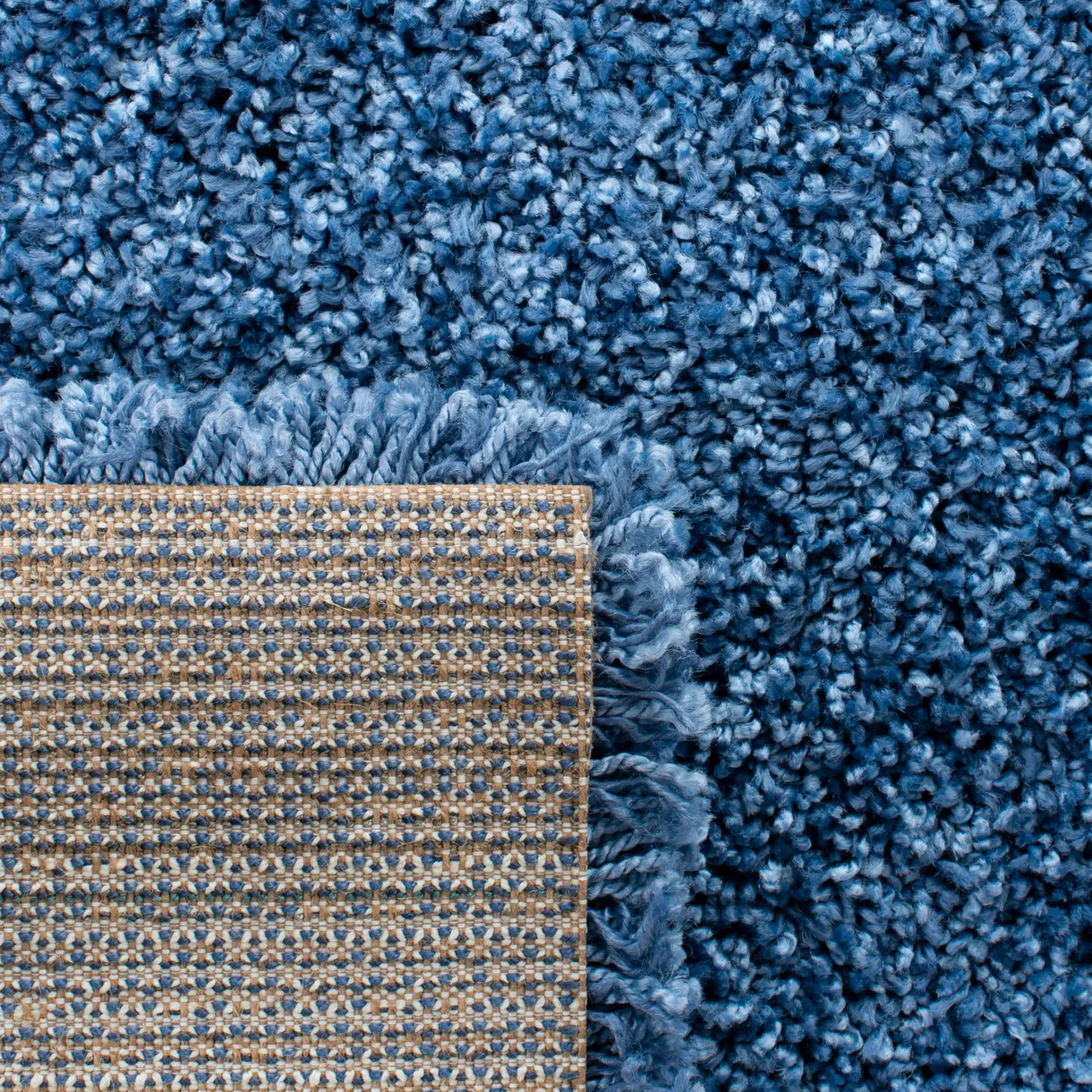 Evolution Solid Shag Rug in Blue in a styled room