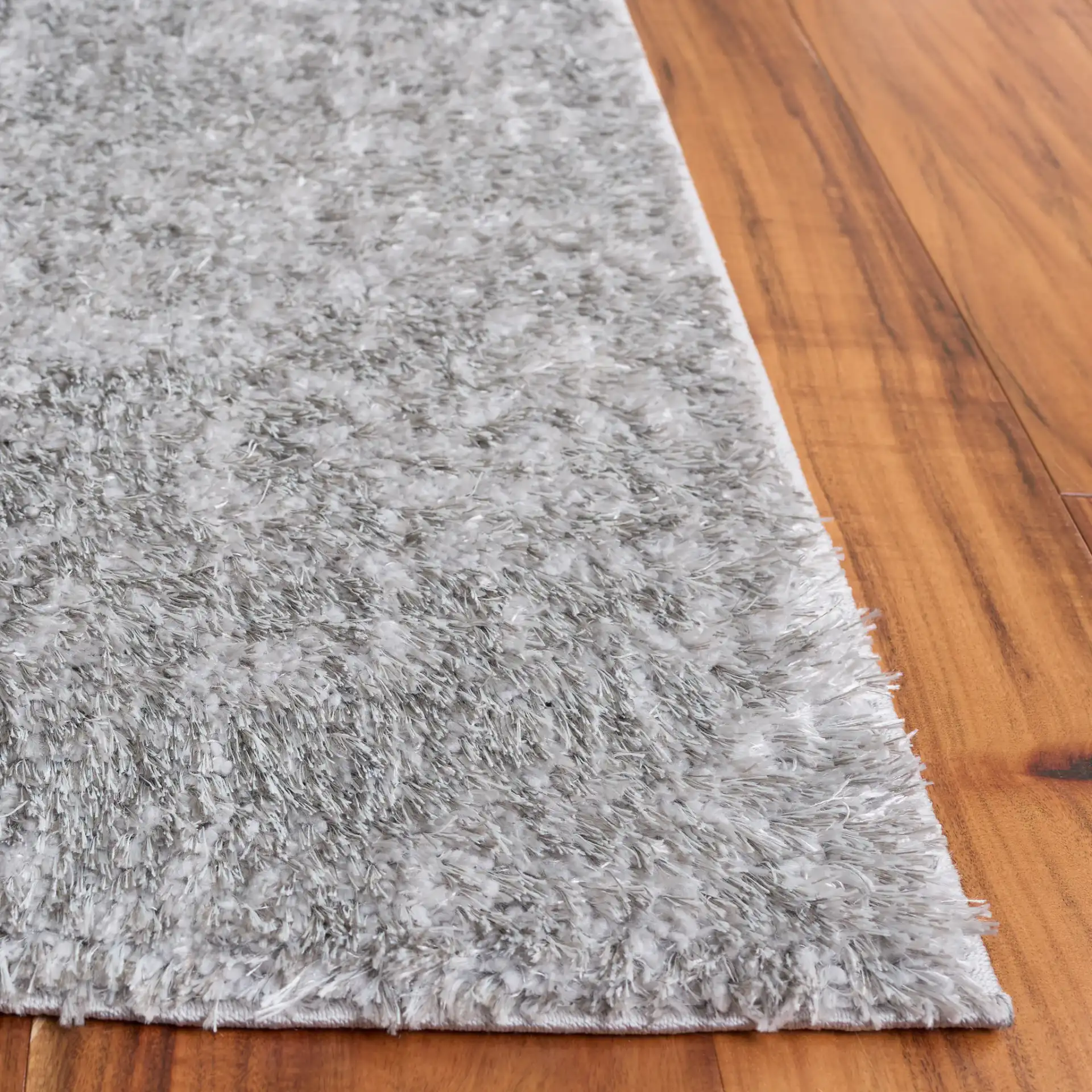 Everett Solid Shag Rug in Gray in a styled room
