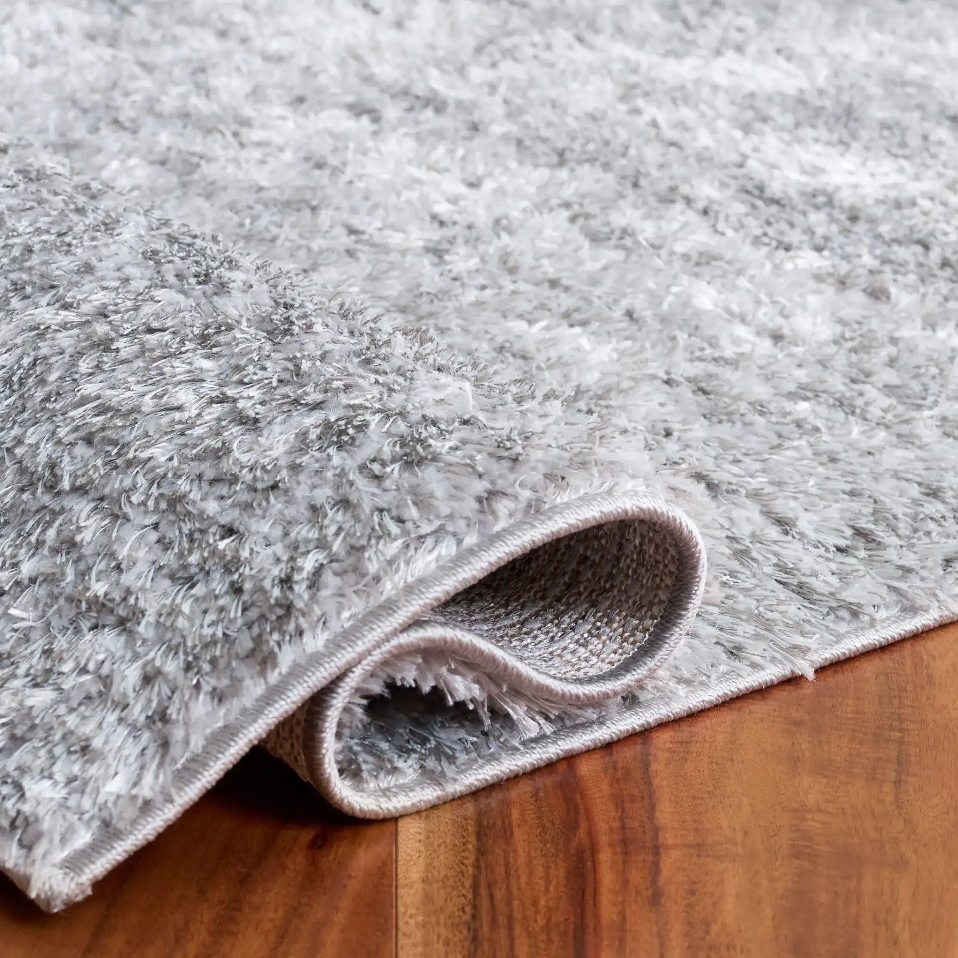 Everett Solid Shag Rug in Gray in a styled room