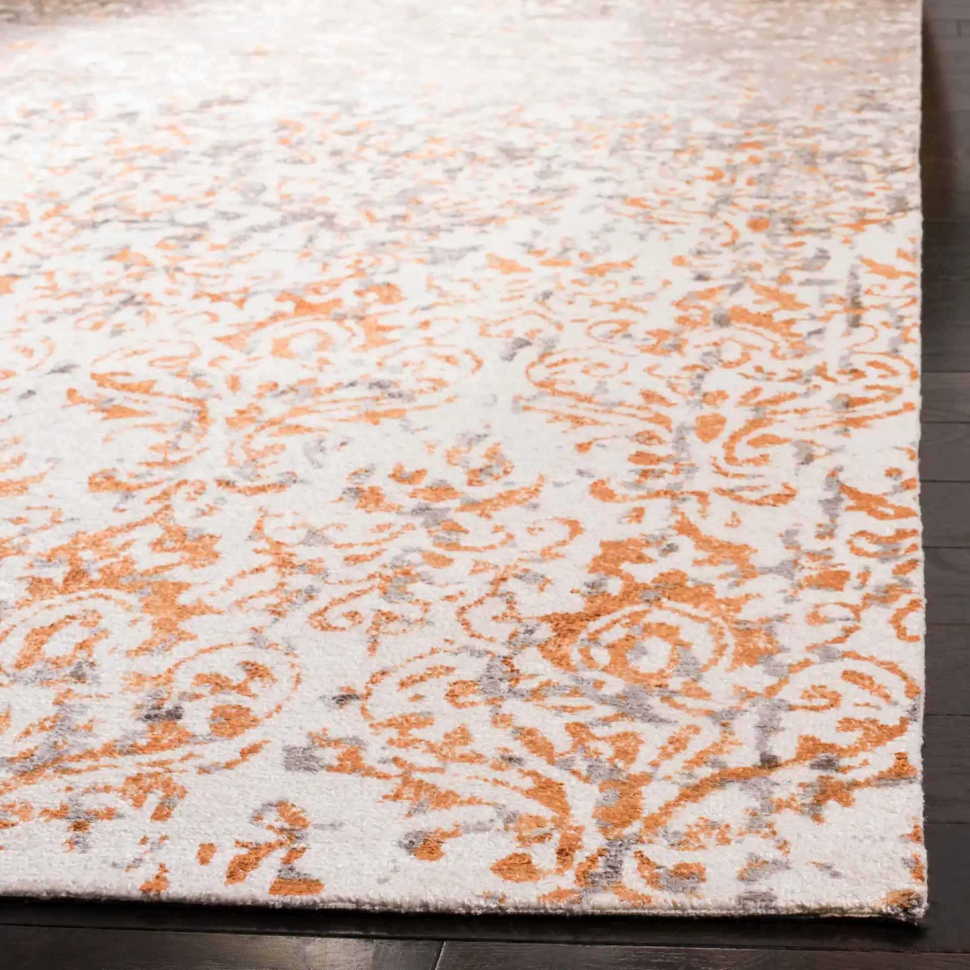Expression Faded Damask Hand-Tufted Viscose Rug in Ivory / Rust in a styled room