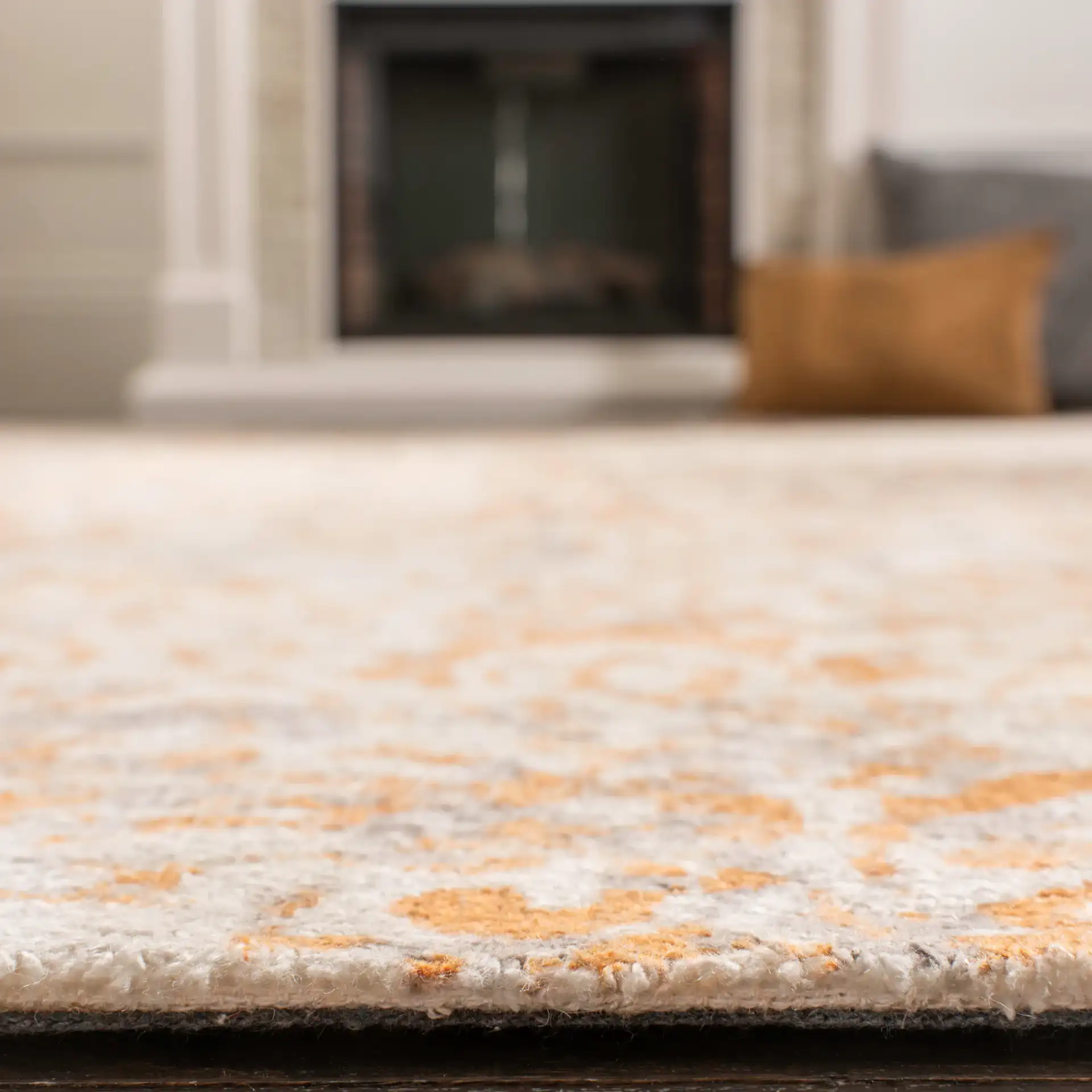Expression Faded Damask Hand-Tufted Viscose Rug in Ivory / Rust in a styled room