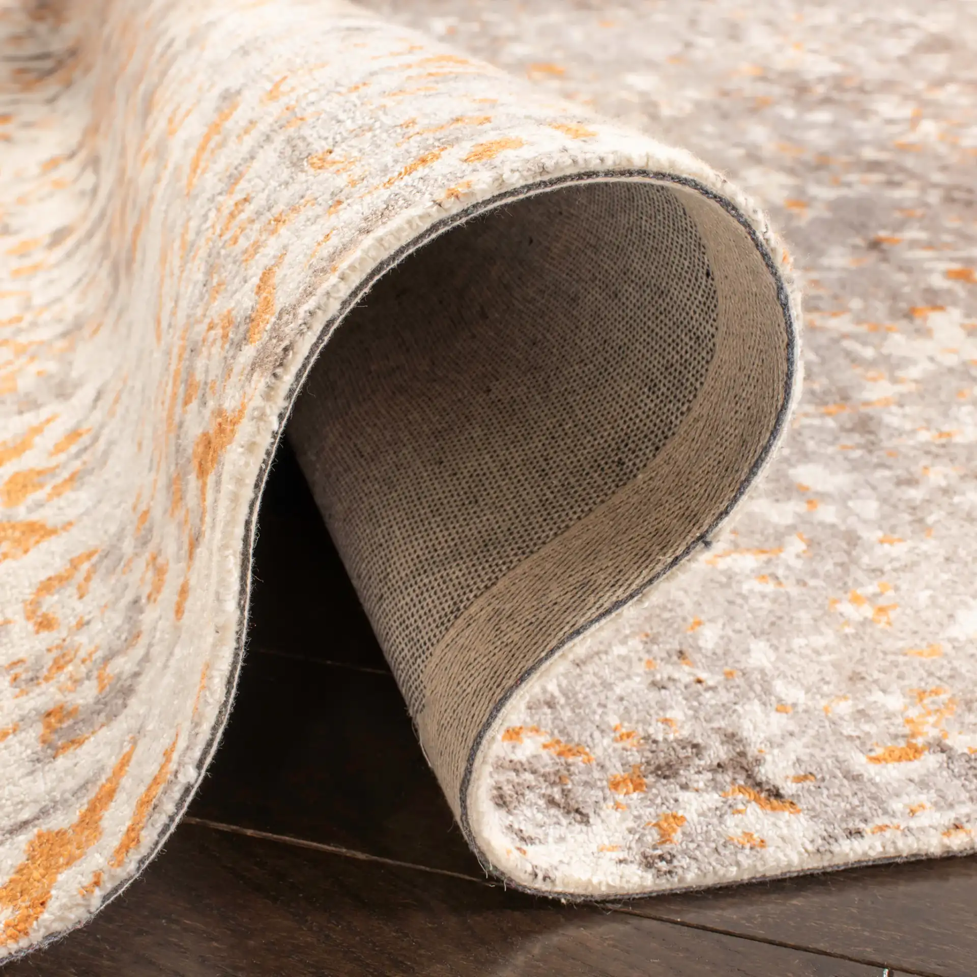 Expression Faded Damask Hand-Tufted Viscose Rug in Ivory / Rust in a styled room