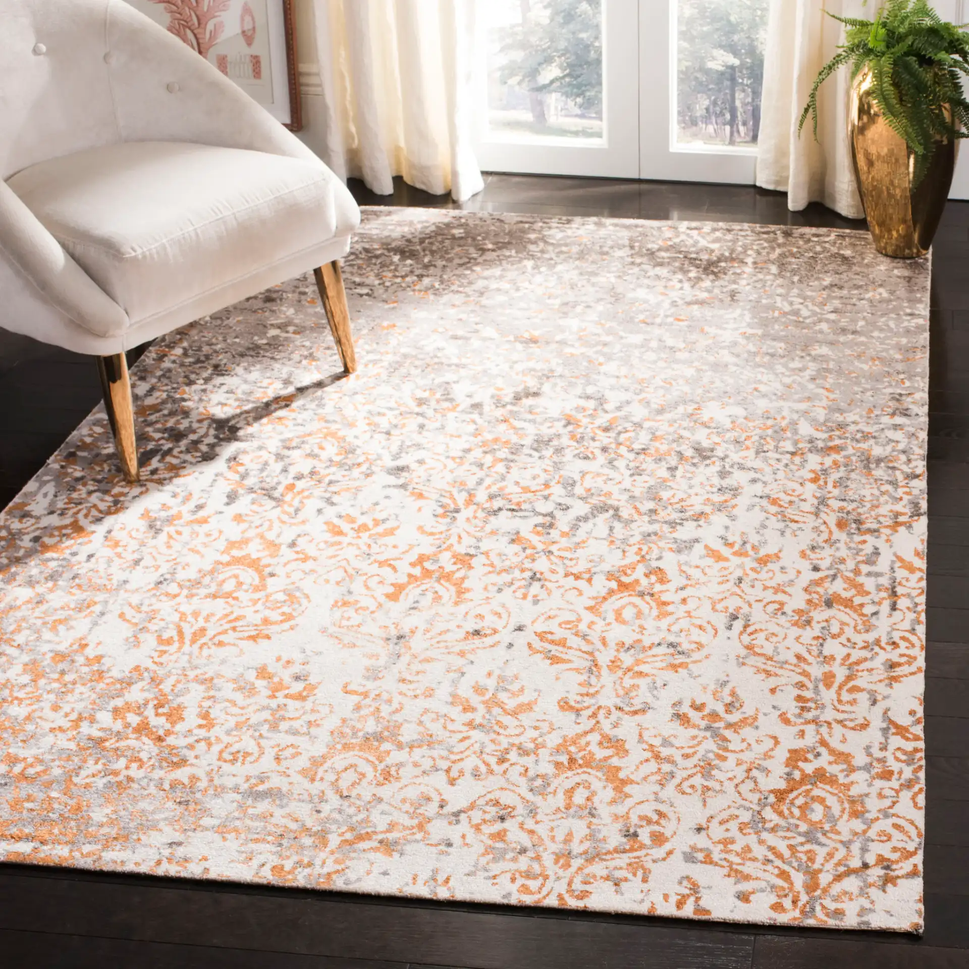 Expression Faded Damask Hand-Tufted Viscose Rug in Ivory / Rust in a styled room