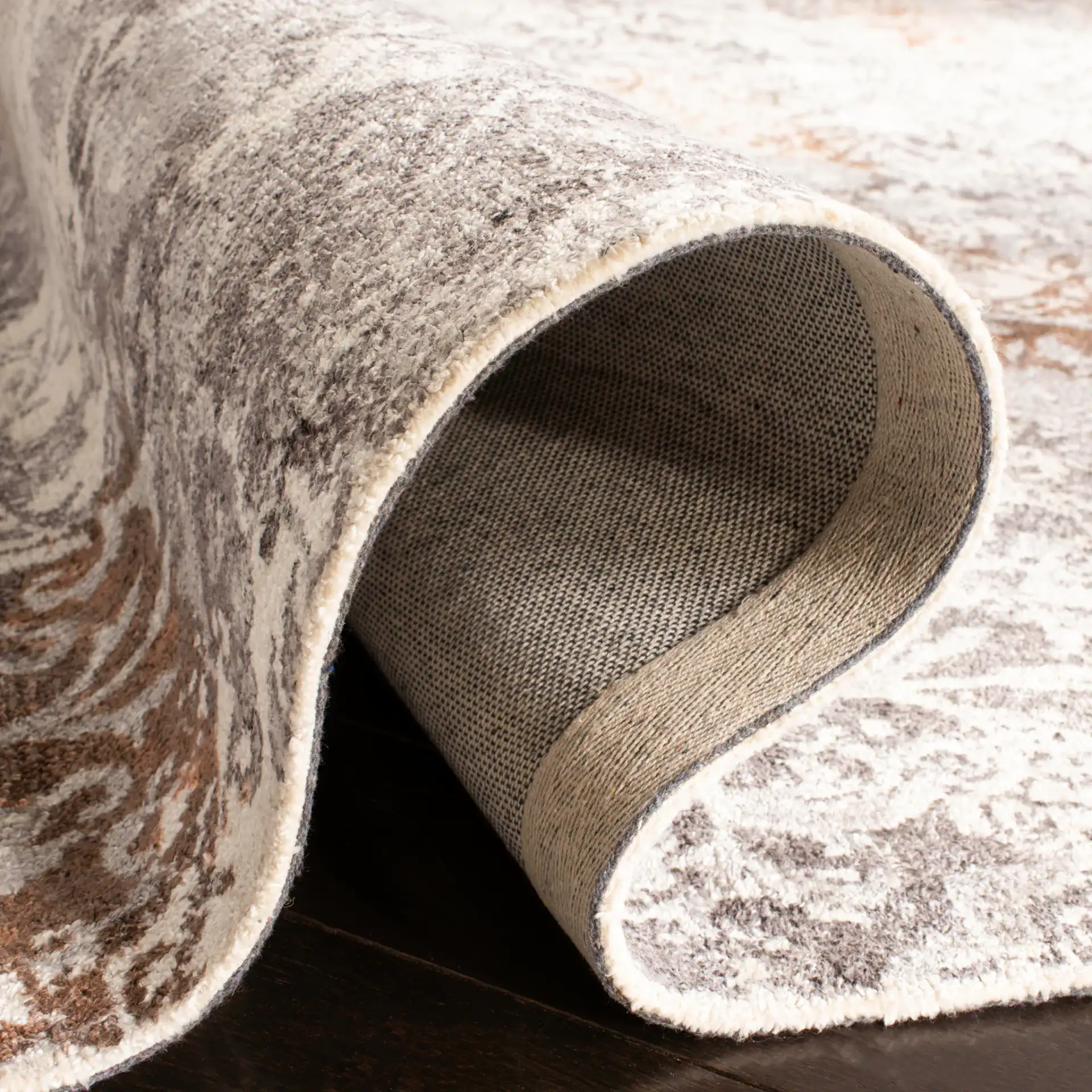 Expression Distressed Damask Hand-Tufted Viscose Rug in Ivory / Gray in a styled room