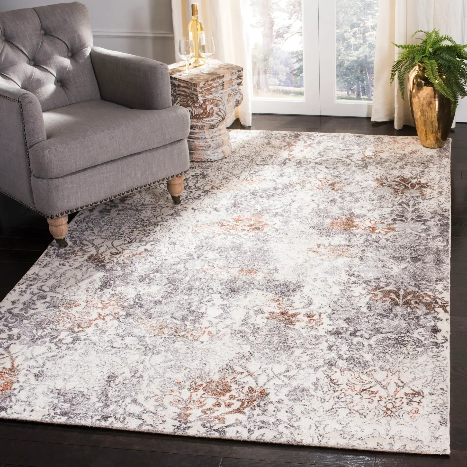 Expression Distressed Damask Hand-Tufted Viscose Rug in Ivory / Gray in a styled room