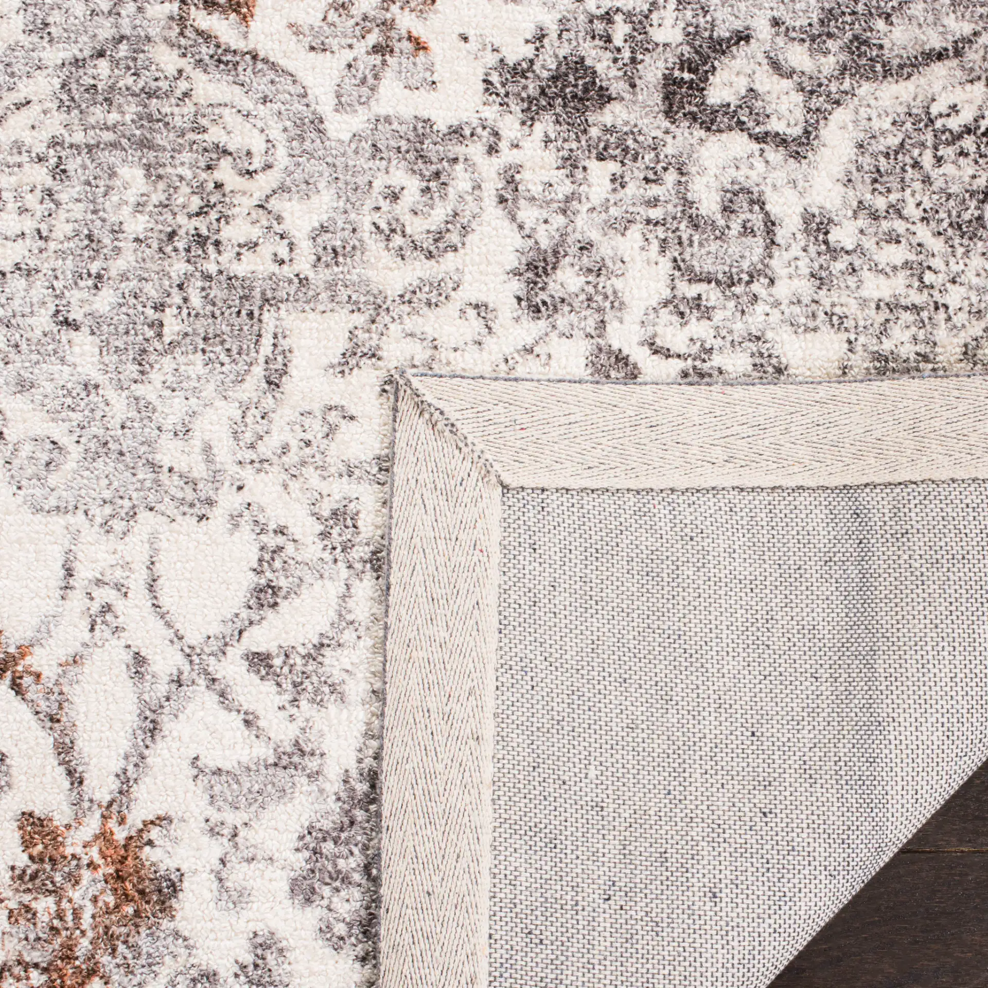 Expression Distressed Damask Hand-Tufted Viscose Rug in Ivory / Gray in a styled room