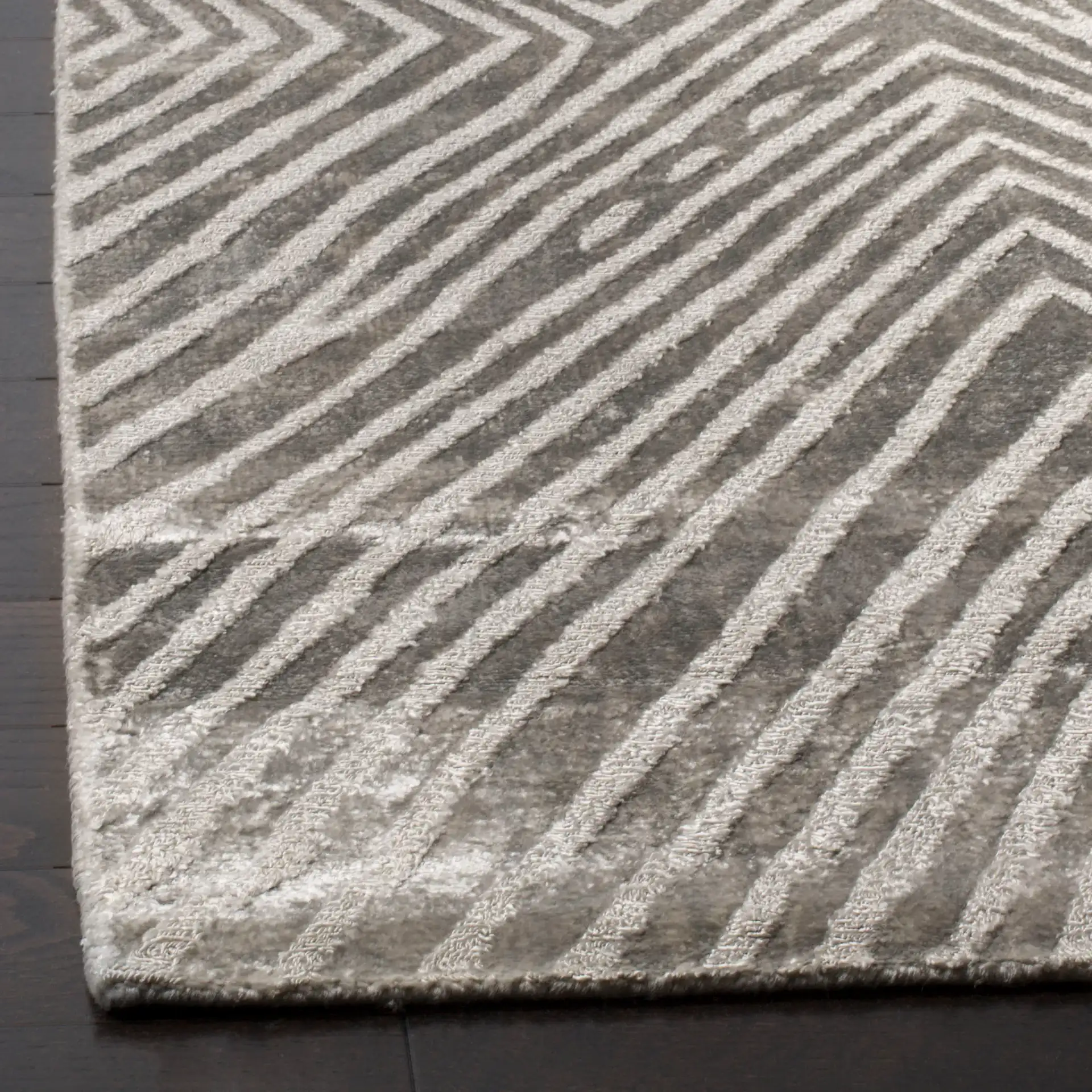Expression Concentric Diamond Hand-Woven Rug in Dark Gray in a styled room