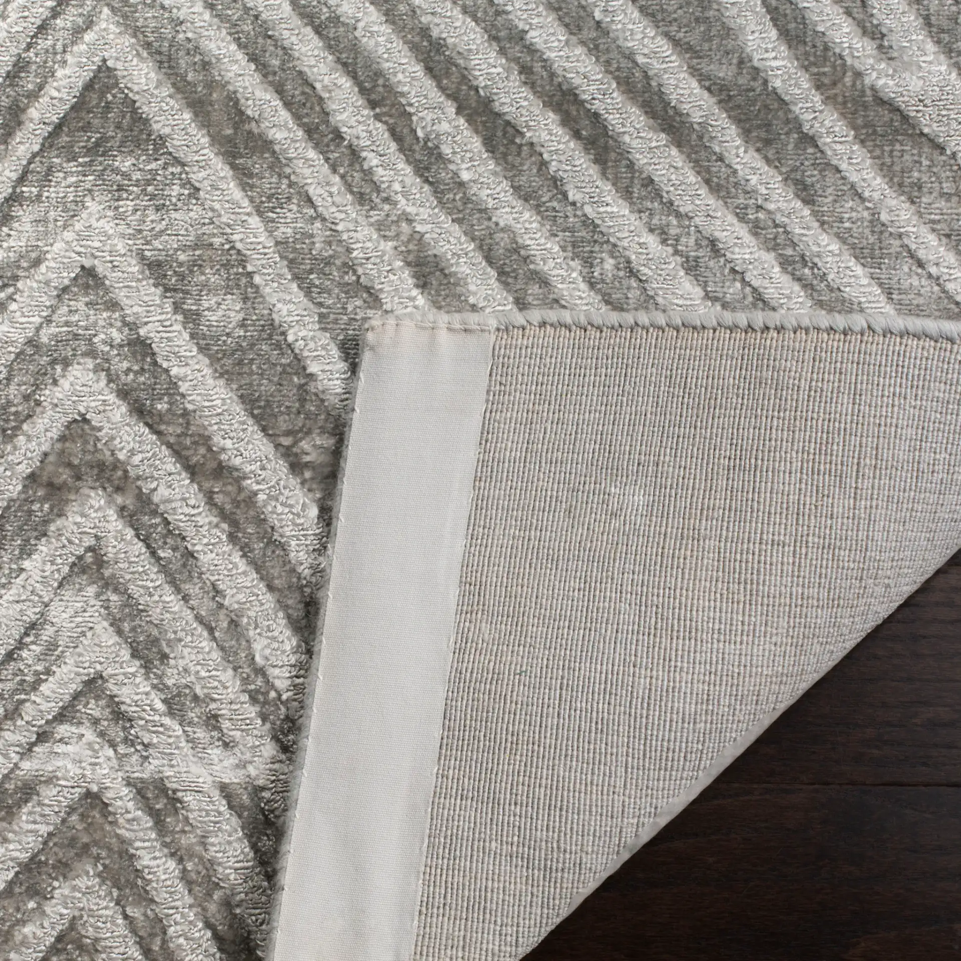 Expression Concentric Diamond Hand-Woven Rug in Dark Gray in a styled room