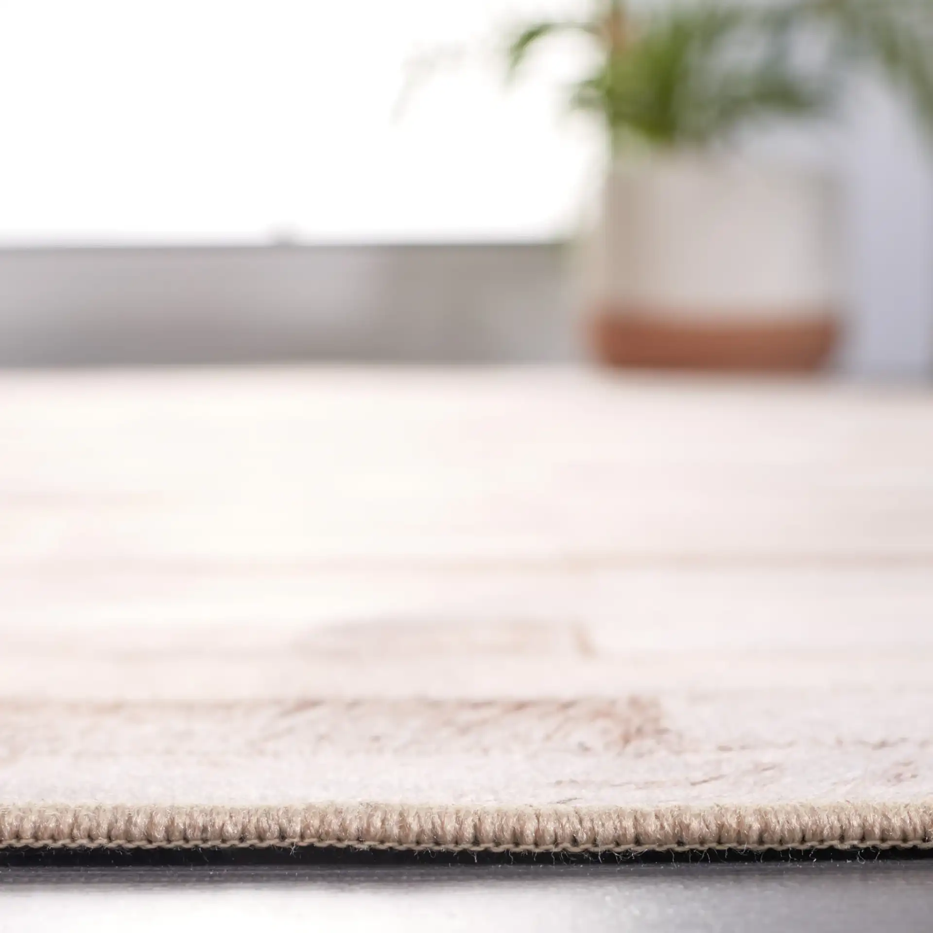 Faux Hide Brick Patchwork Washable Rug in Beige / Brown in a styled room