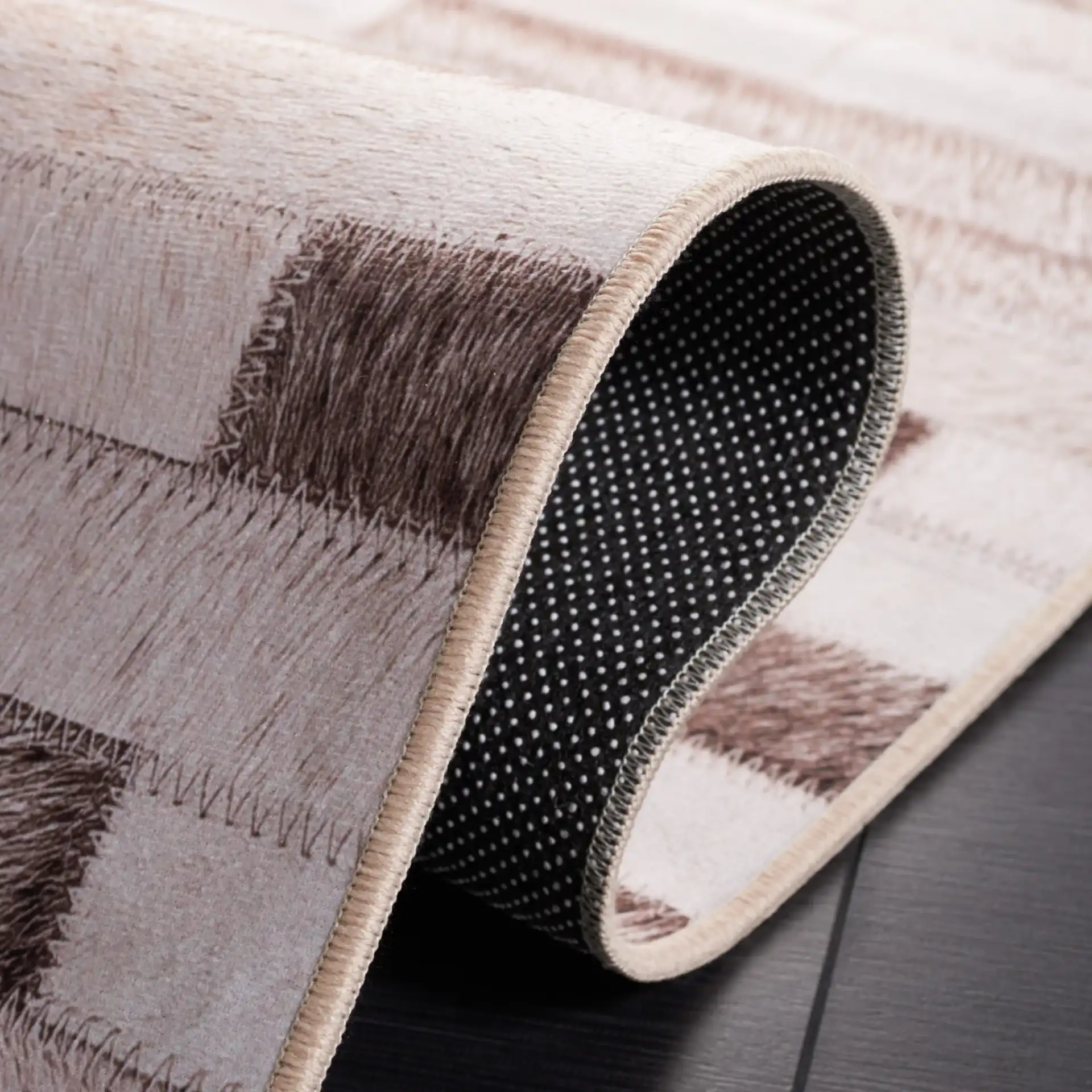 Faux Hide Brick Patchwork Washable Rug in Beige / Brown in a styled room