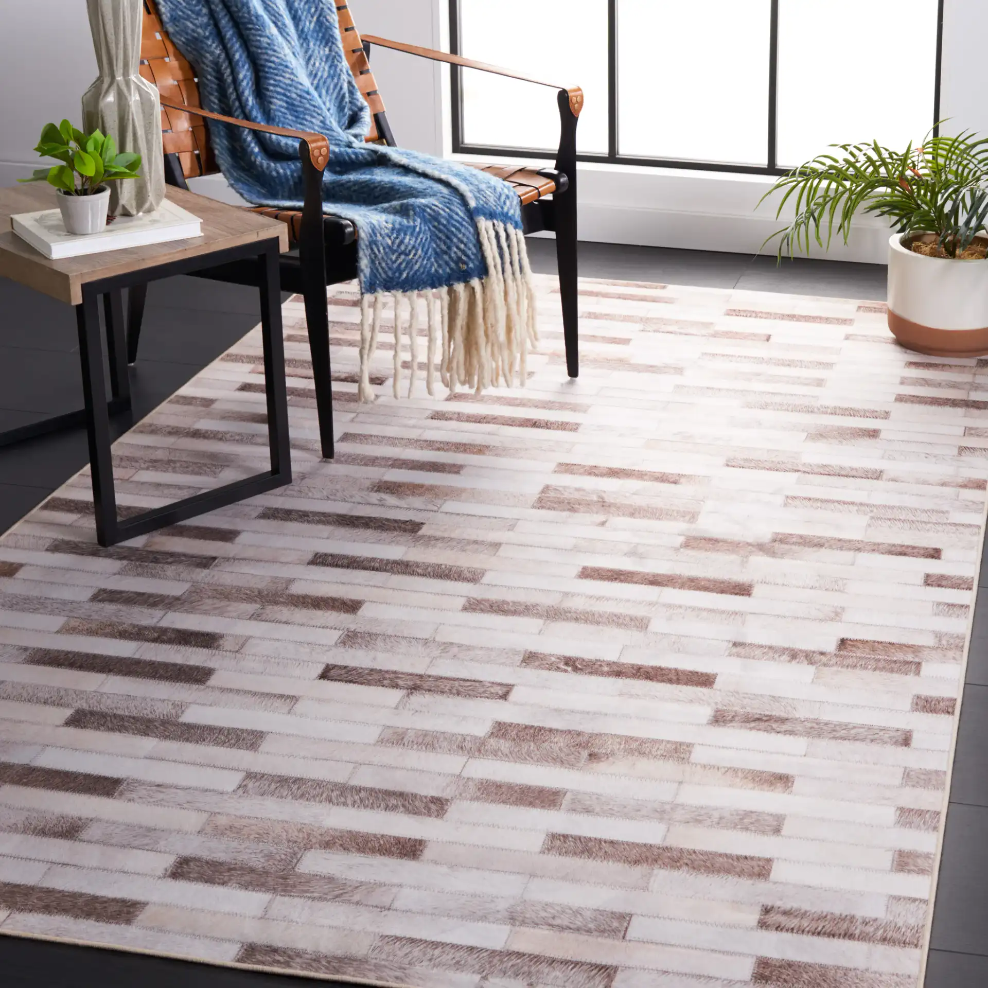 Faux Hide Brick Patchwork Washable Rug in Beige / Brown in a styled room