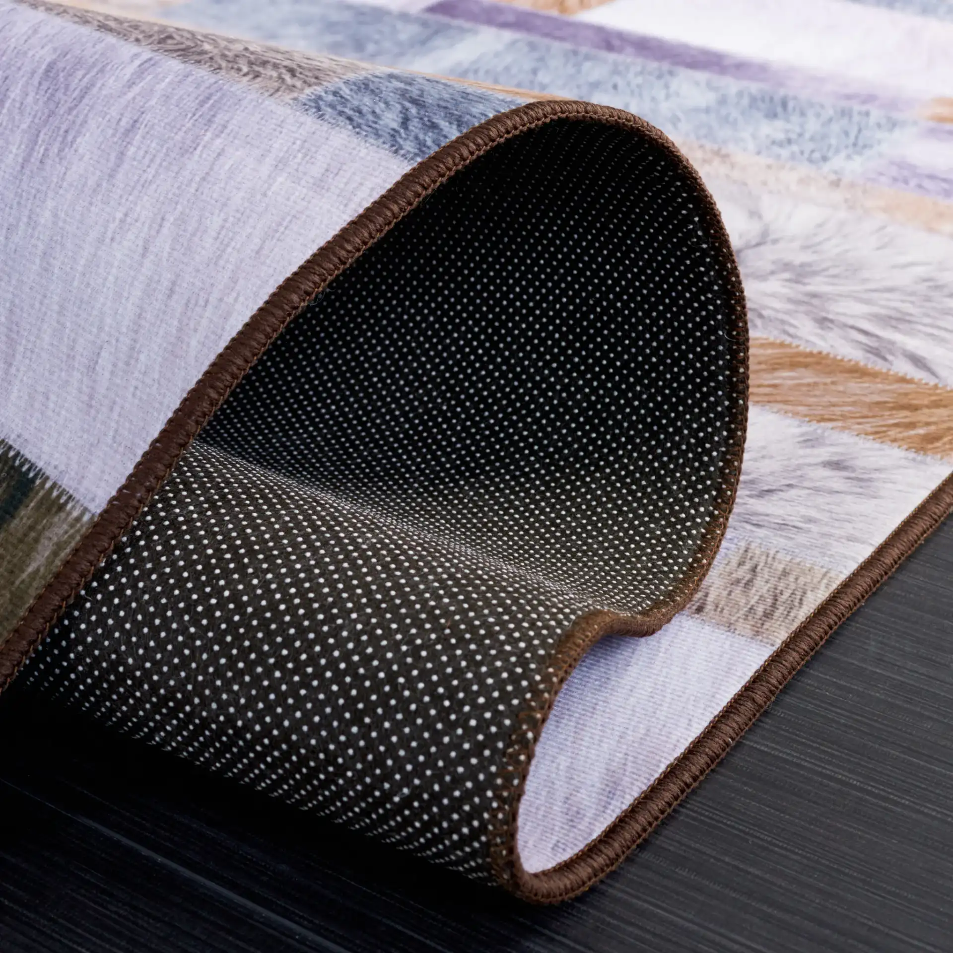 Faux Hide Linear Patchwork Washable Rug in Beige / Purple in a styled room